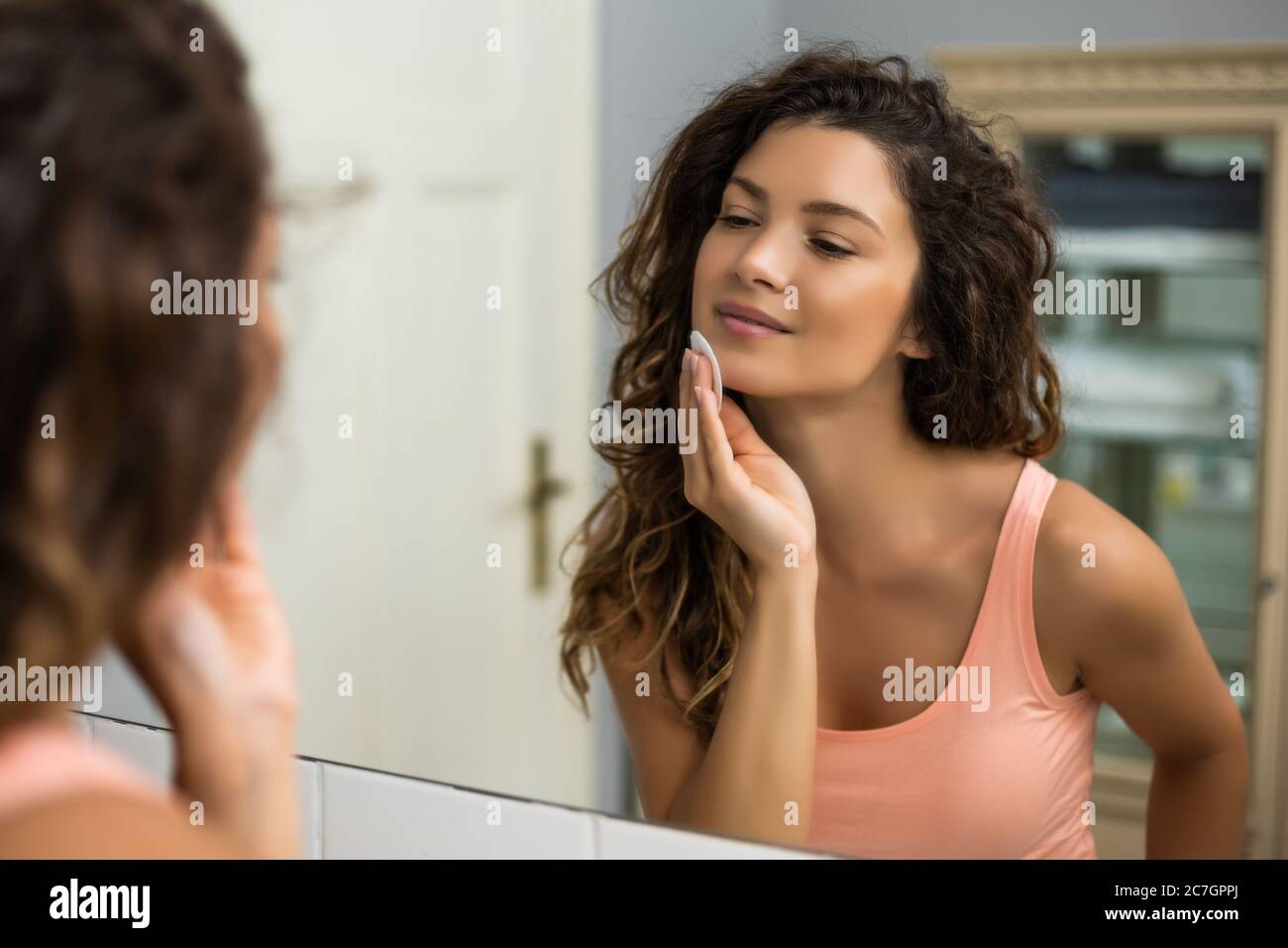 Reflection woman cleaning face hi-res stock photography and images - Alamy