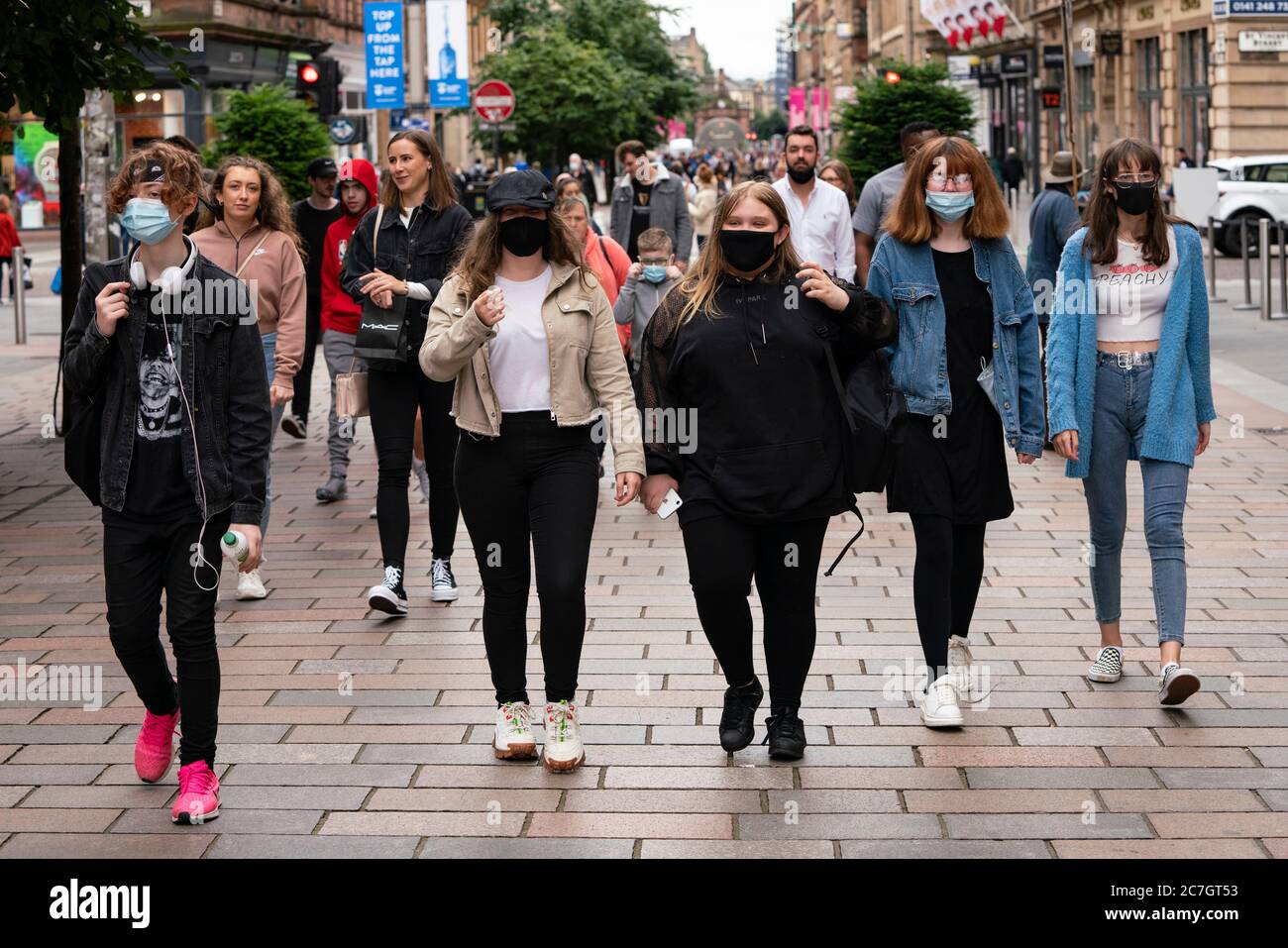 Glasgow, Scotland, UK. 17 July, 2020.  Images from Glasgow city centre as covid-19 restrictions are relaxed and  the public are out and about shopping and at work. Pictured; Young women walking on Buchanan Street wearing face coverings. Iain Masterton/Alamy Live News Stock Photo