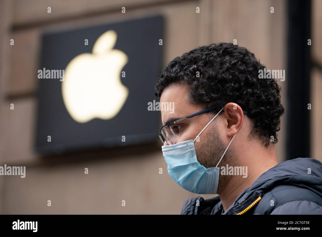 Glasgow, Scotland, UK. 17 July, 2020.  Images from Glasgow city centre as covid-19 restrictions are relaxed and  the public are out and about shopping and at work. Pictured; Man wearing facemark waiting in queue outside Apple shop. Iain Masterton/Alamy Live News Stock Photo