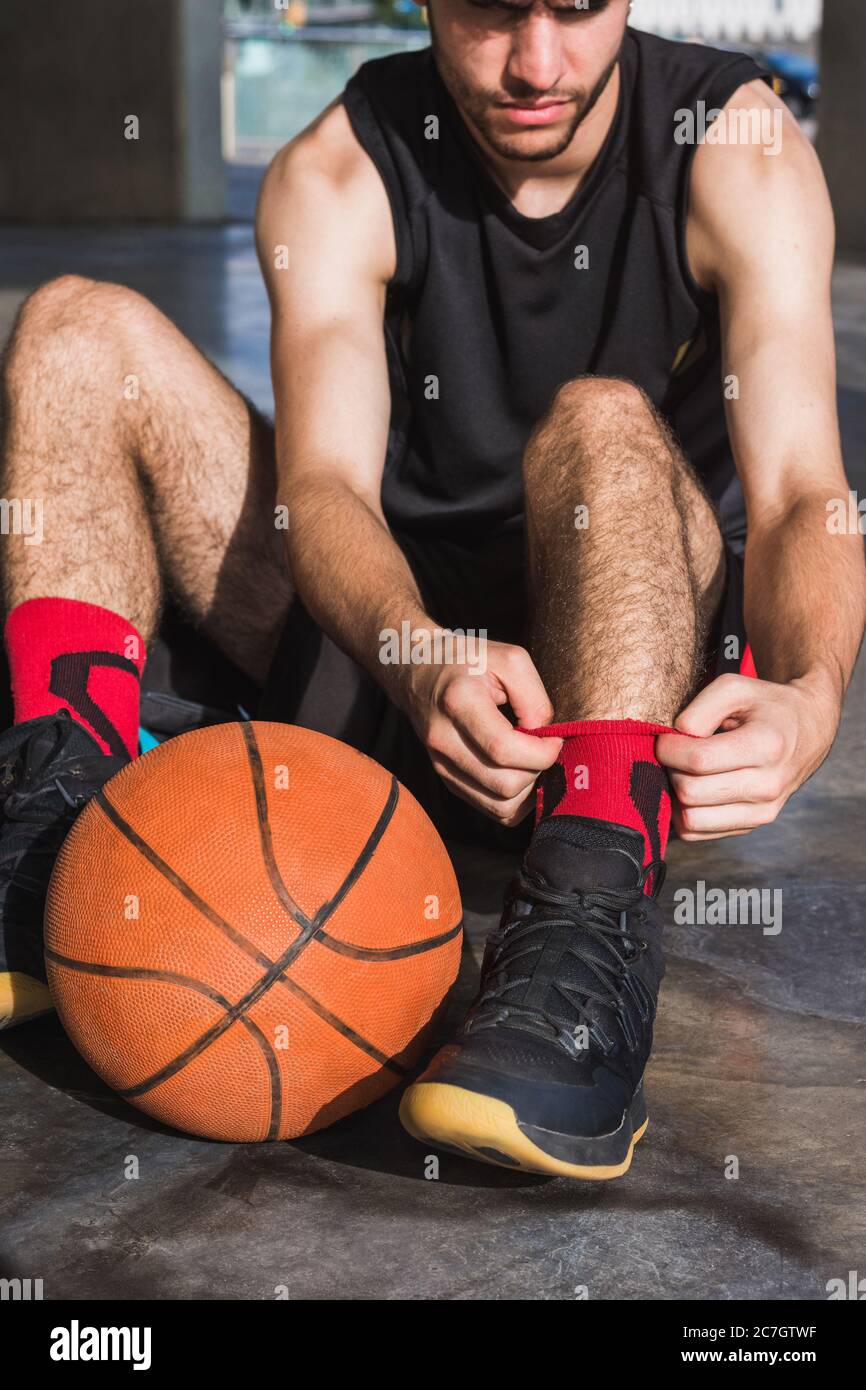 young man getting ready to play basketball Stock Photo Alamy