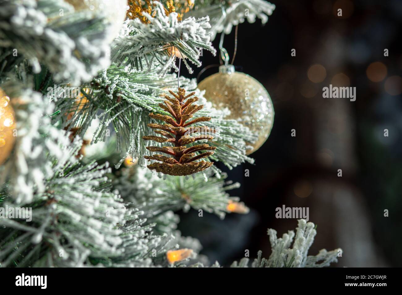 Closeup of Christmas decorations and lights on a Christmas tree with a ...