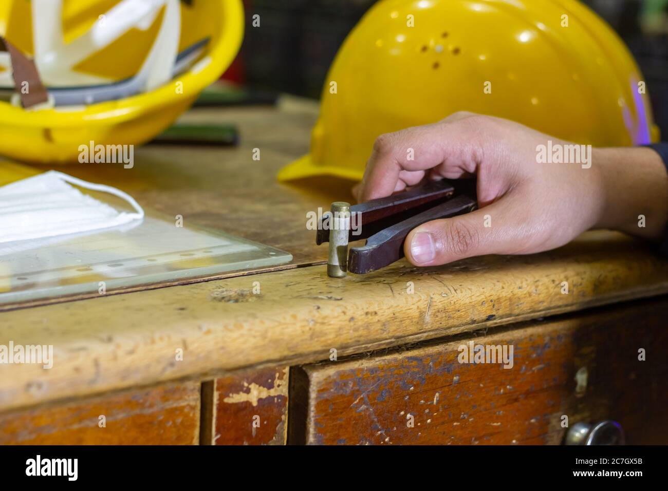 construction worker using a black holder Stock Photo Alamy