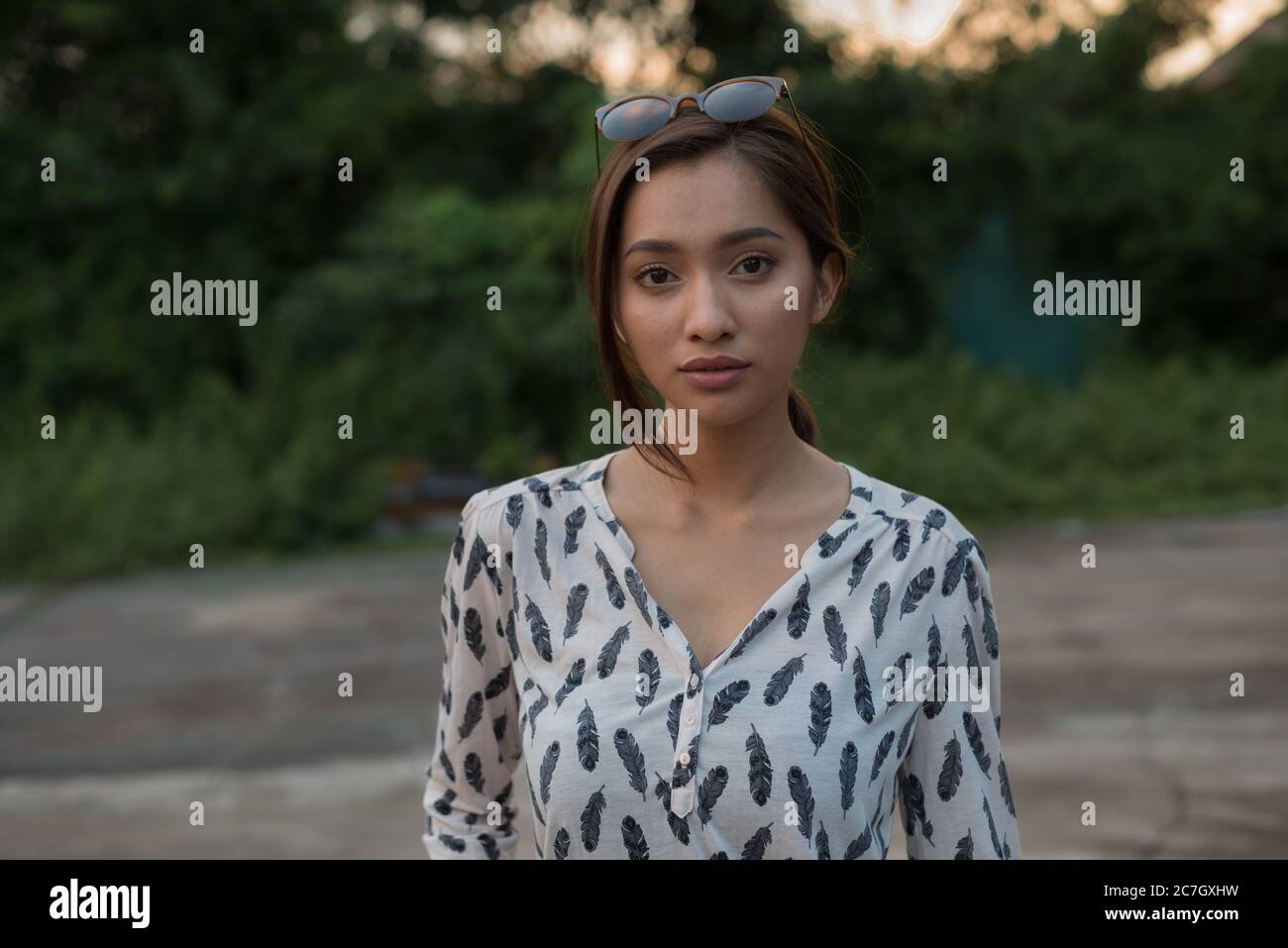 Portrait of young beautiful Asian woman outdoors Stock Photo - Alamy