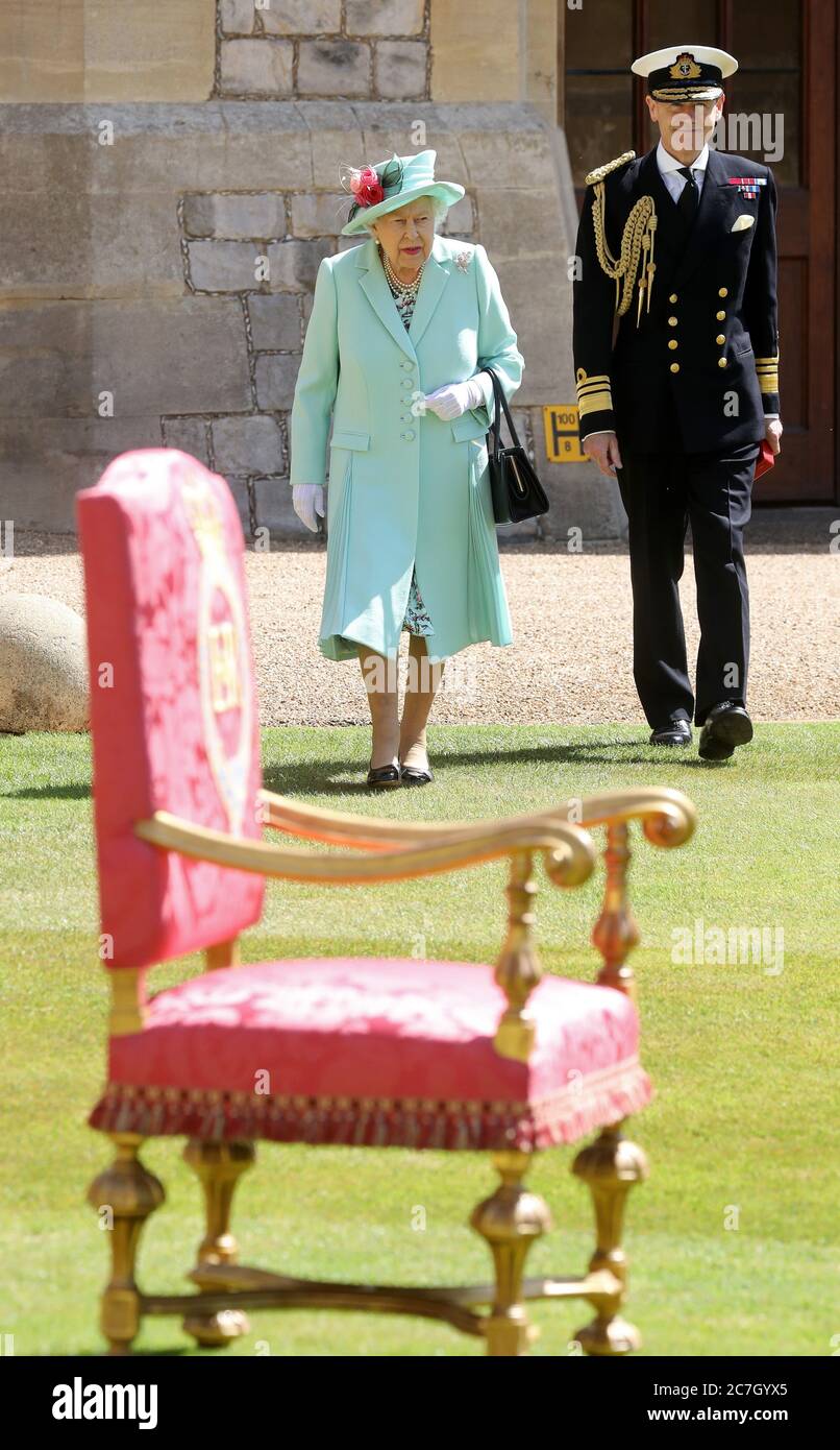 Queen Elizabeth II arrives to present Captain Sir Thomas Moore with his