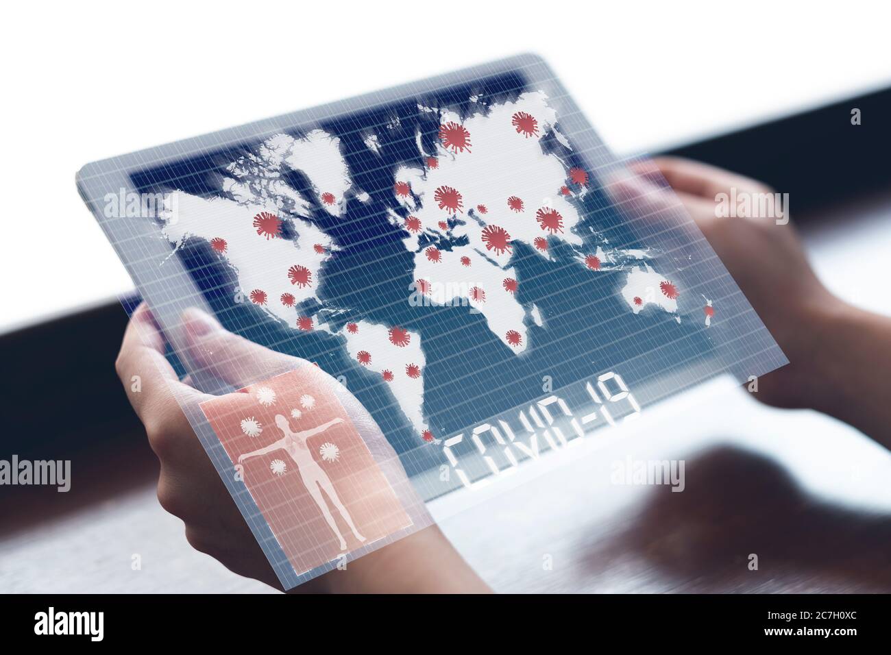 Woman holding tablet watching world map with Coronavirus or Covid-19 outbreak around the world Stock Photo