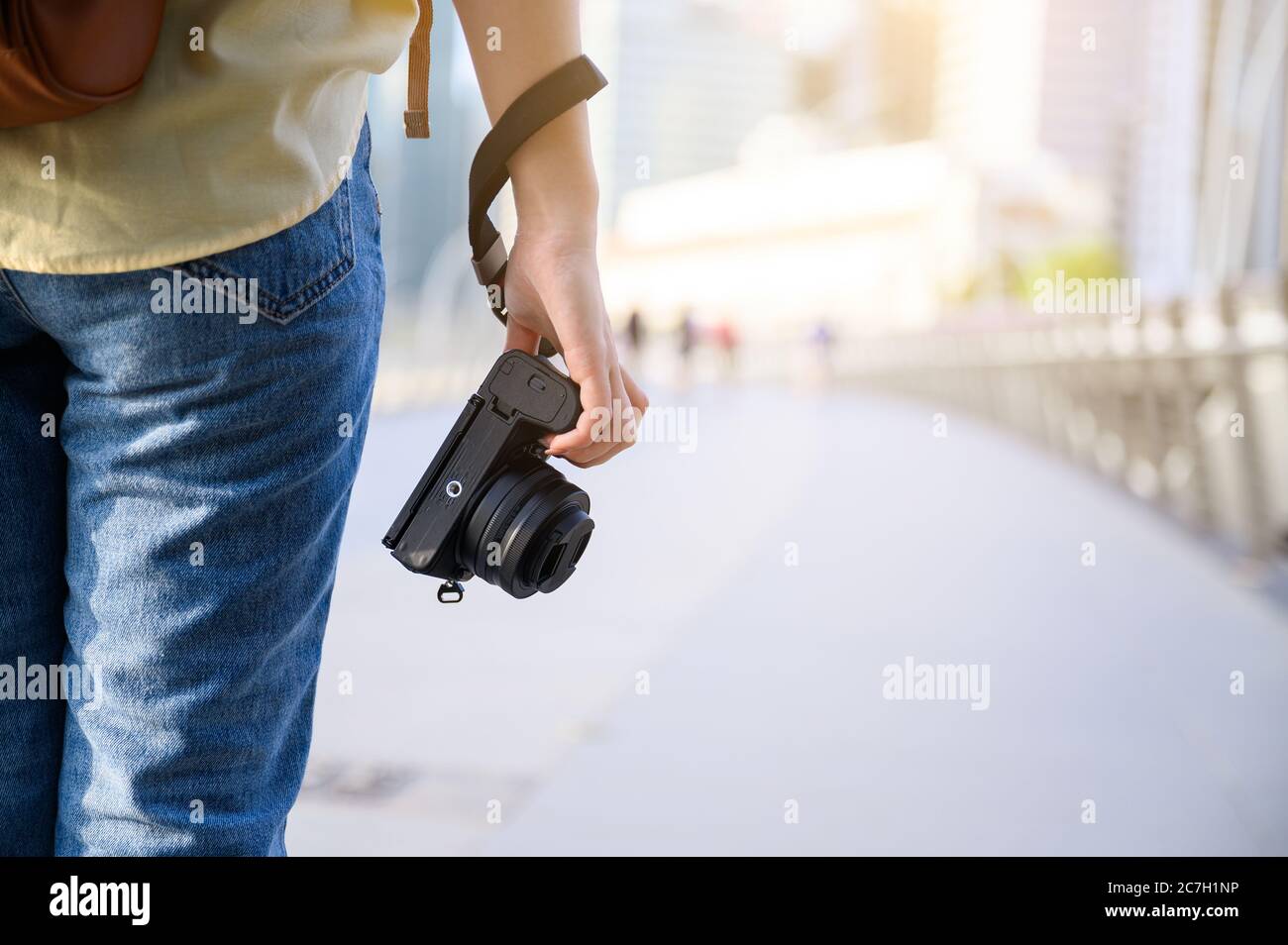 Photographer and traveler concept, Woman holding the digital camera while traveling in Singapore city Stock Photo