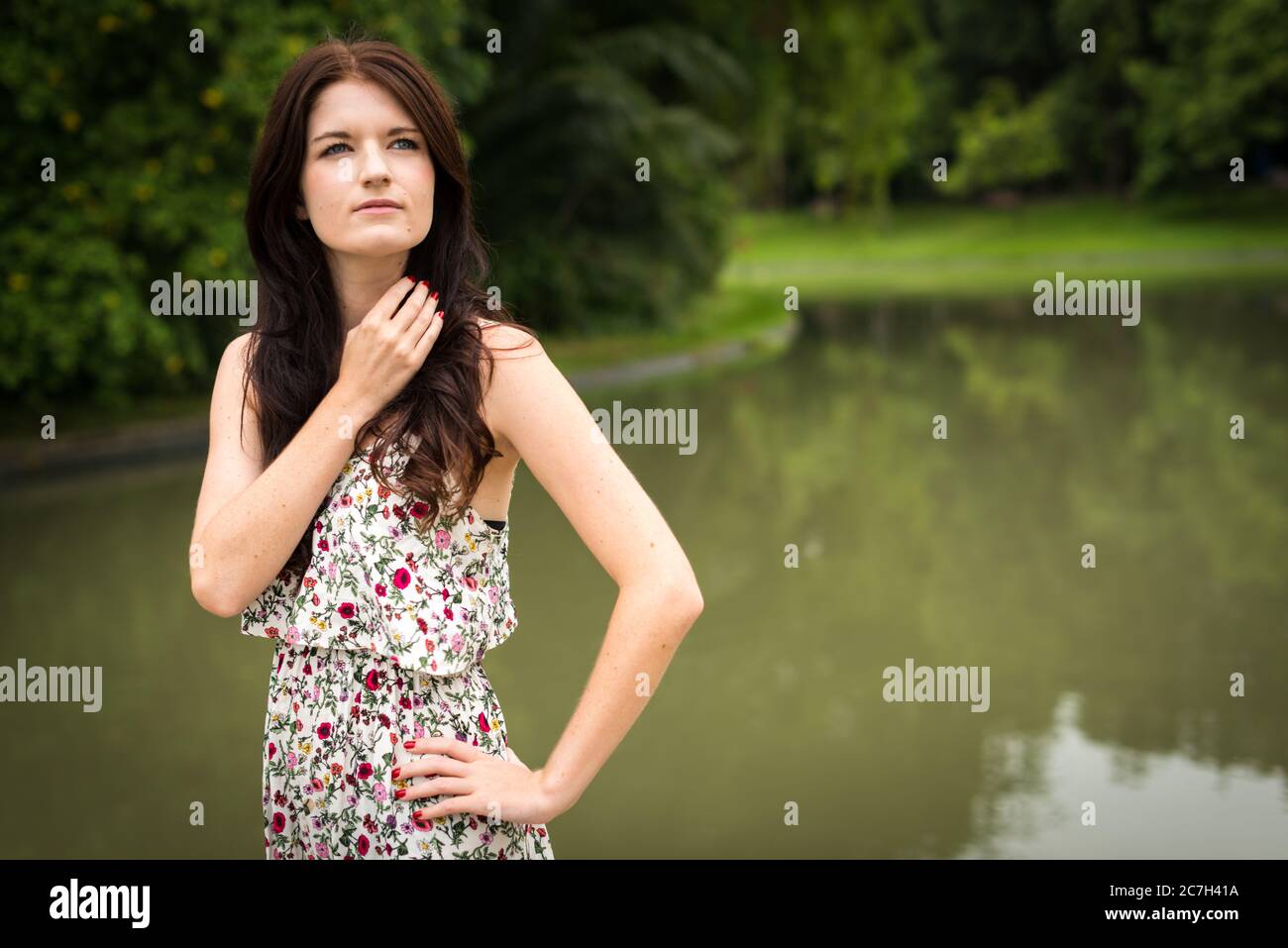 Portrait of young beautiful woman at the park outdoors Stock Photo - Alamy