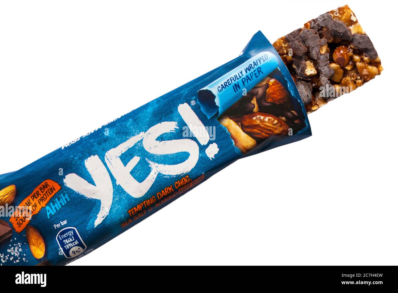 Yes tempting dark choc, sea salt & almond nut bar opened to show contents set on white background - vegetarian, gluten free & high in fibre Stock Photo