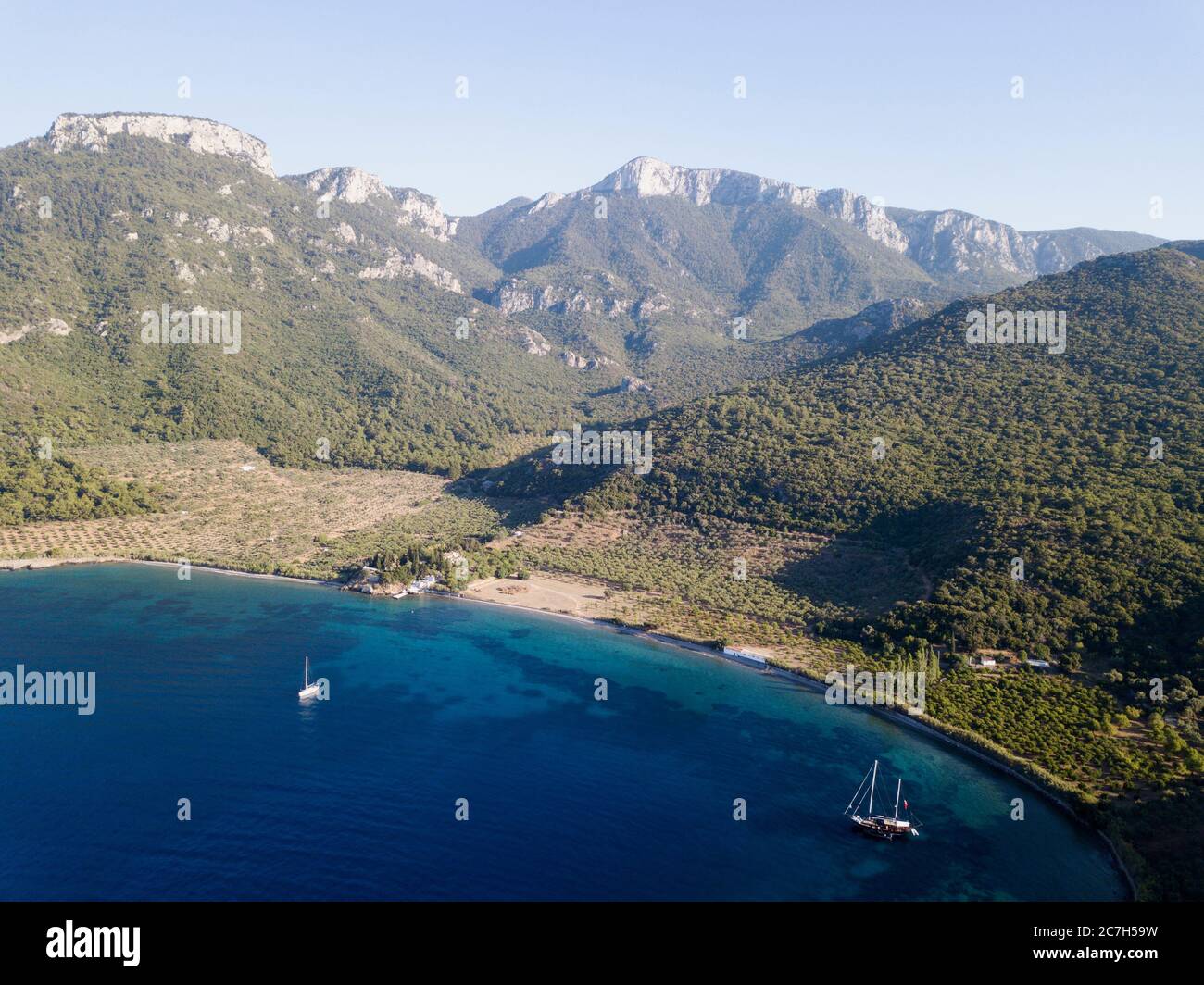 Aerial view of a sailing boat in Mersincik Cove, Datca Peninsula Turkey ...