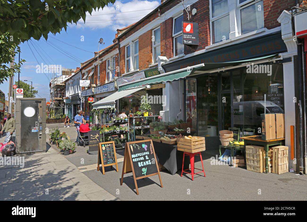 Honor Oak, London, UK. Busy shops and cafes on Stondon Park. Stock Photo