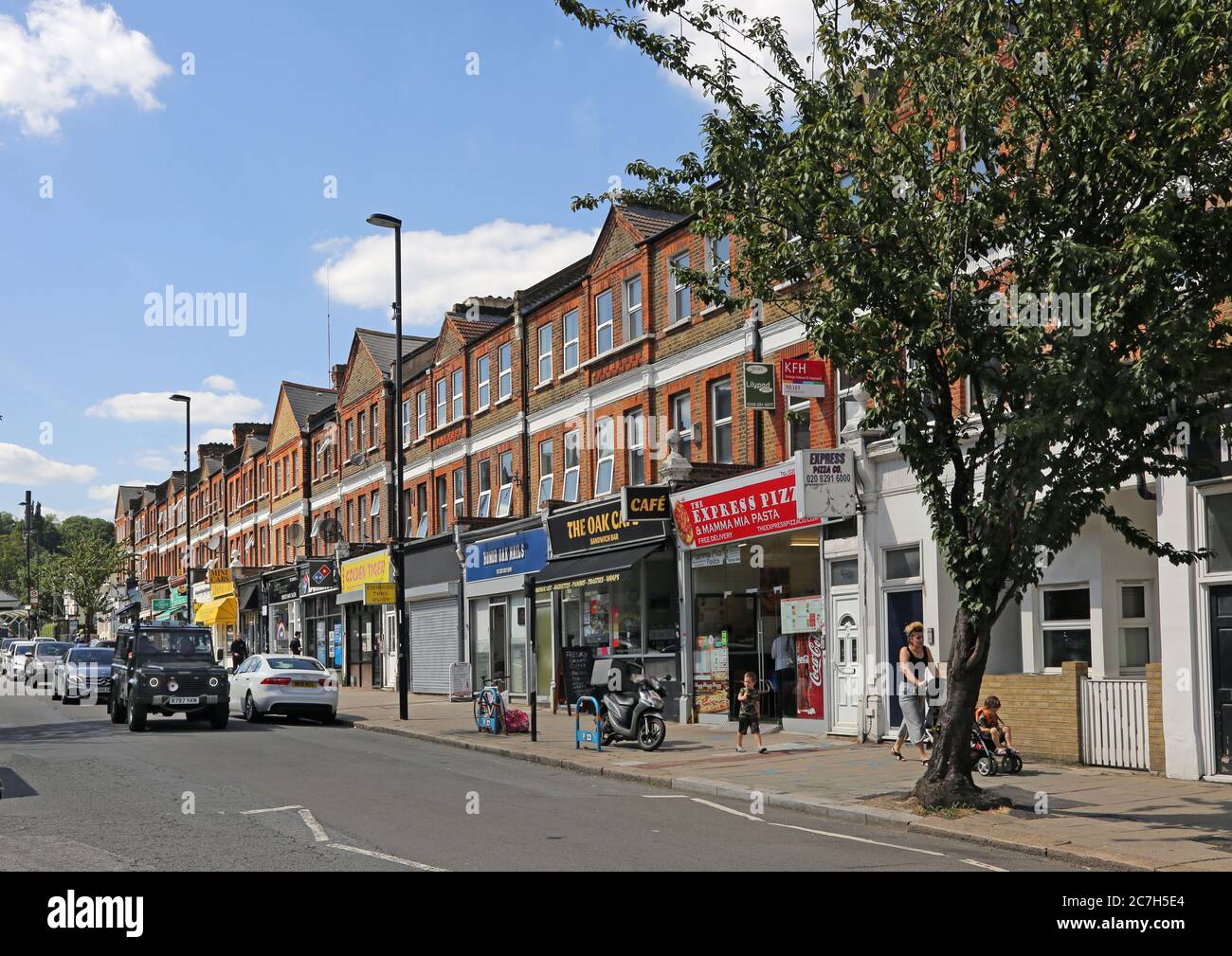 Honor Oak, London, UK. Shops and cafes on Honor Oak Park, the main shopping street in this south London suburb. Stock Photo