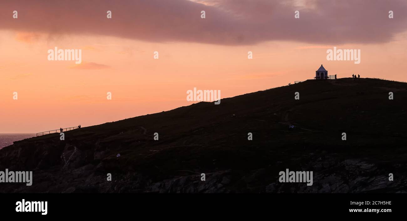 Sunset silhouettes at Fistral beach Stock Photo