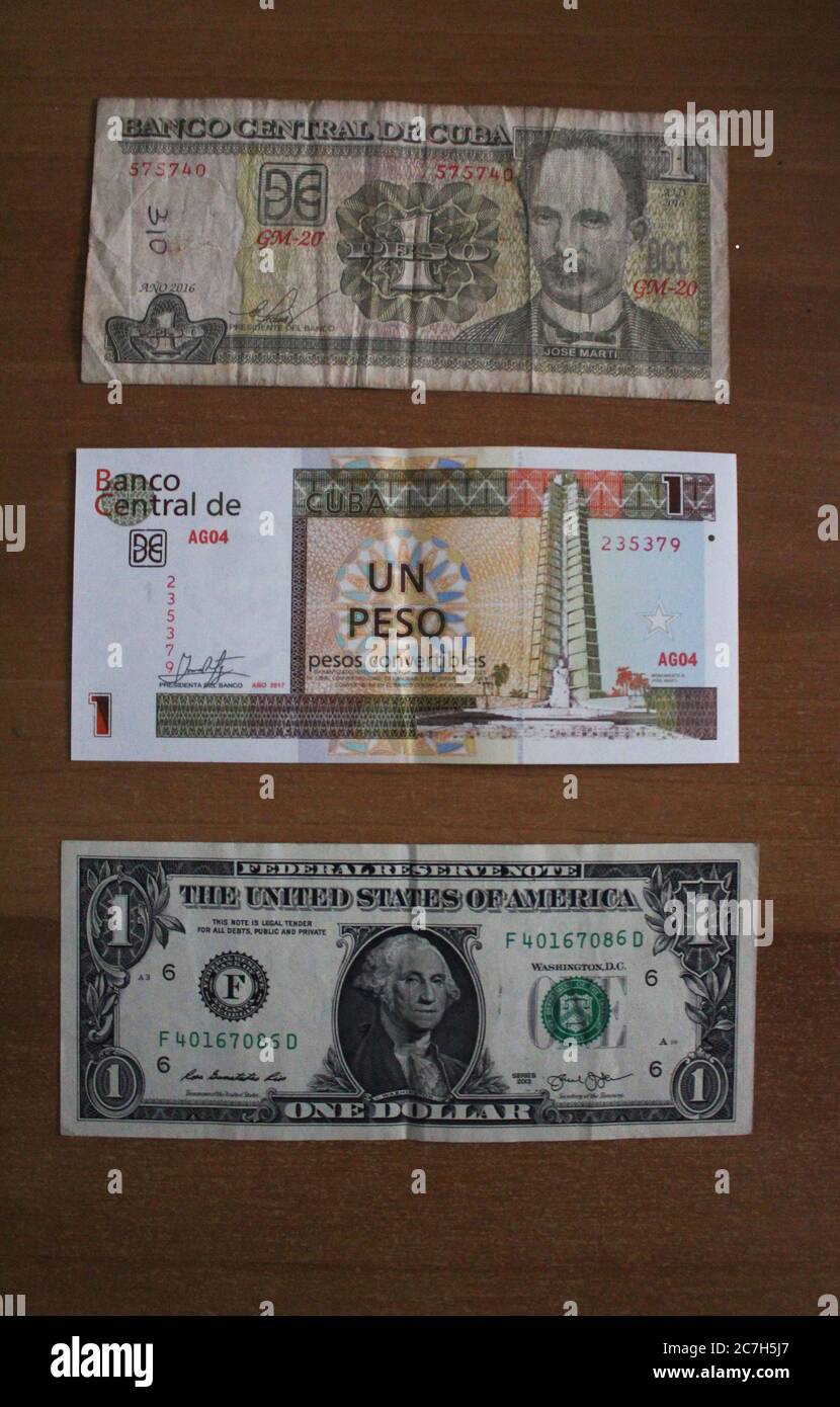 Havanna, Cuba. 17th July, 2020. One Cuban Peso CUP (top to bottom), one  Cuban Peso CUC and one US dollar. The government in Cuba has abolished a  ten percent tax on the