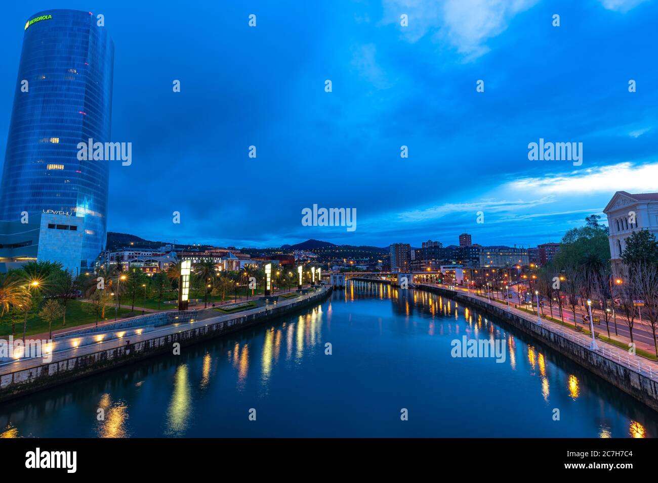 Europe, Spain, Basque Country, Vizcaya Province, Bilbao, view from the Pedro Arrupe Bridge over the Nervión and the evening Bilbao Stock Photo