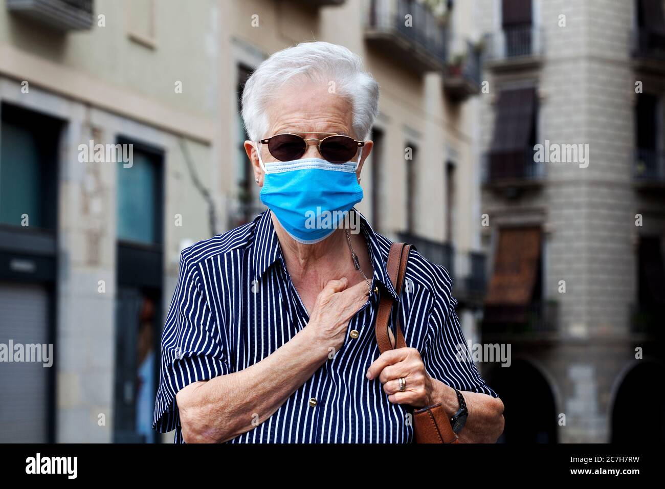 Old Catalan woman wearing face mask. Stock Photo