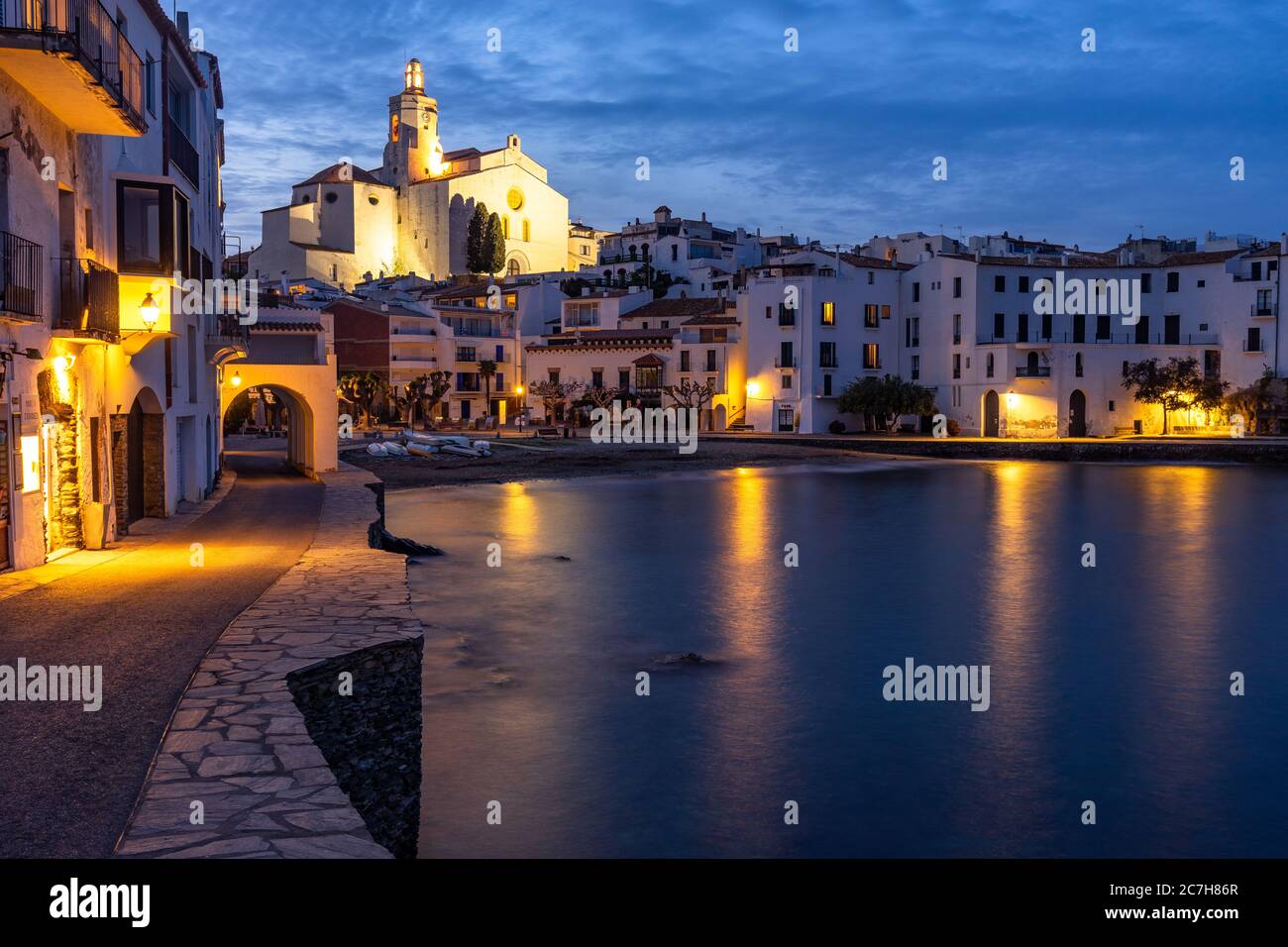 Europe, Spain, Catalonia, Girona, Alt Empordà, Cadaqués, evening mood in the bay of Cadaqués with a view of the Santa Maria church Stock Photo