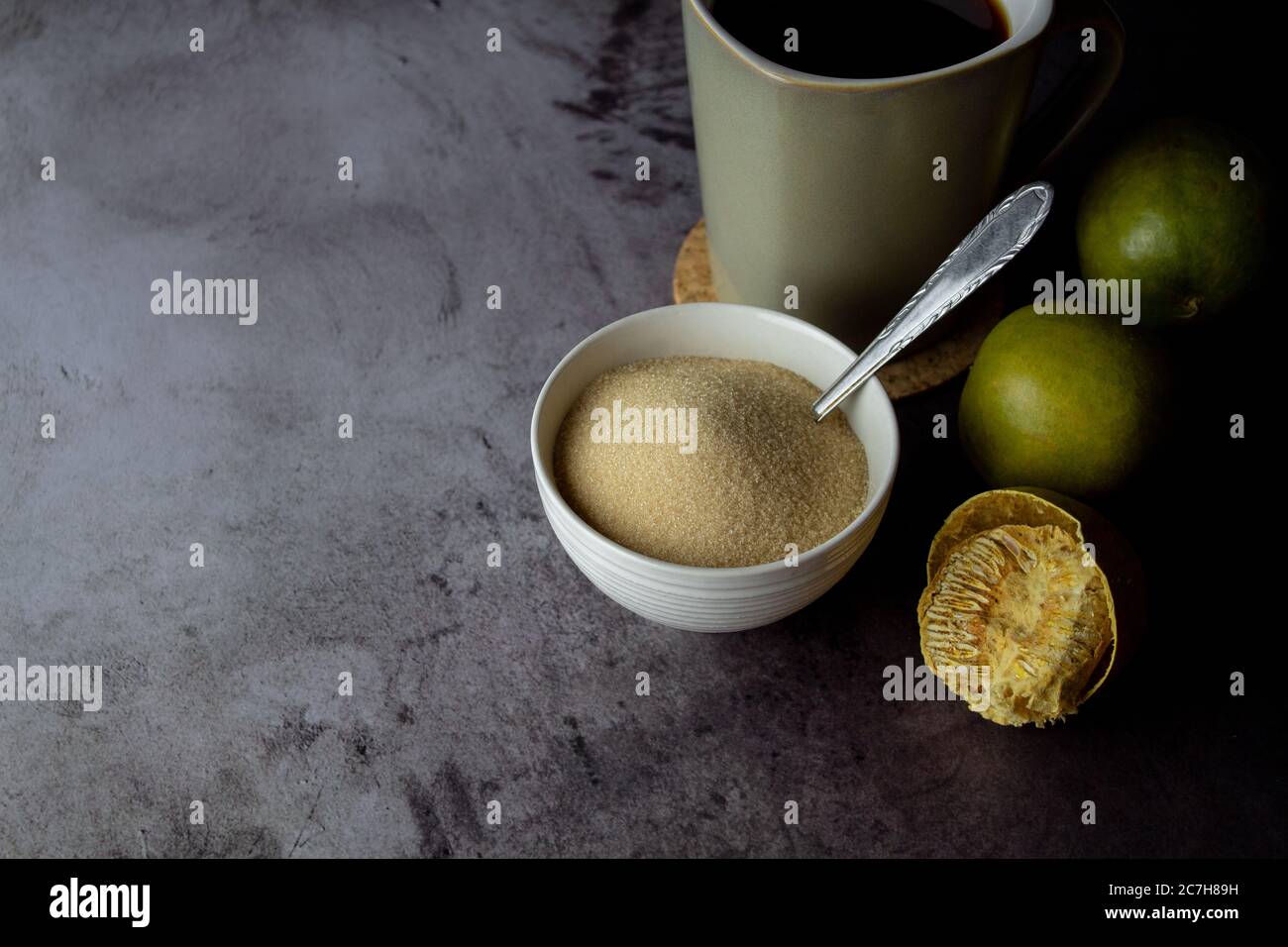 dried monk fruit, luo han guo, and monk fruit sugar crystals with a cup of tea or