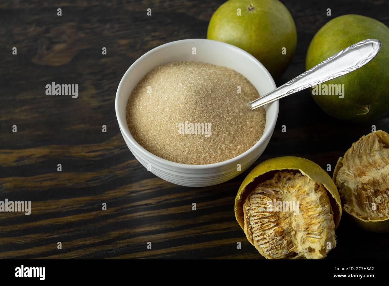 dried monk fruit, luo han guo, and monk fruit sugar crystals with a cup of tea or
