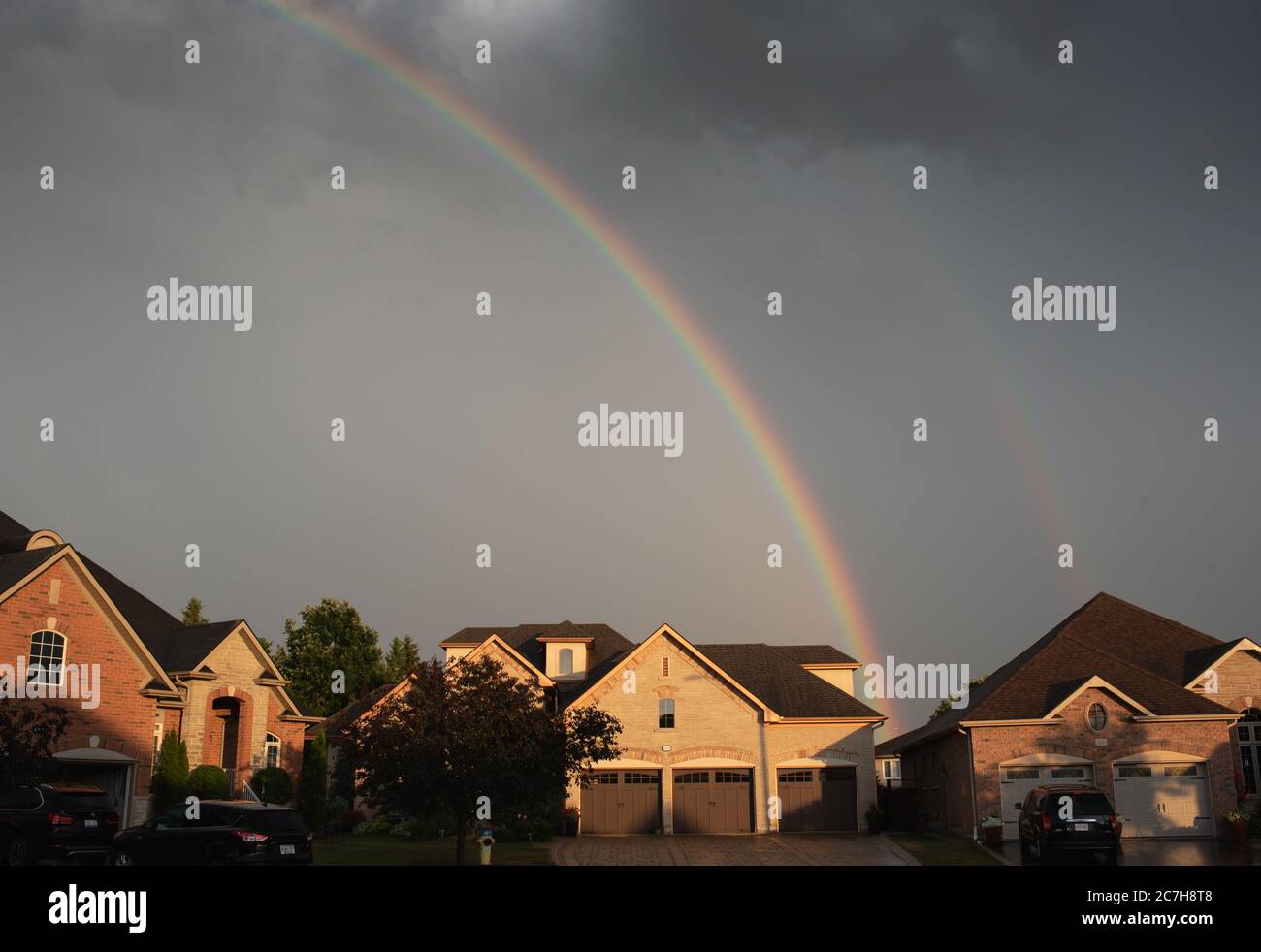 Rainbow against a dark sky hi-res stock photography and images - Alamy