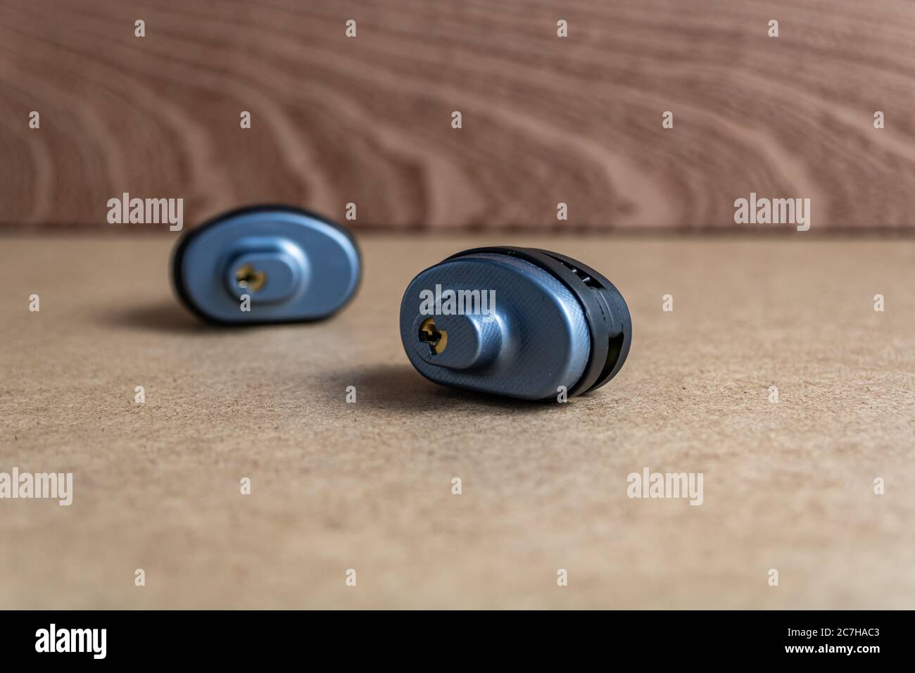 Selective focus shot of a lock on a brown surface Stock Photo
