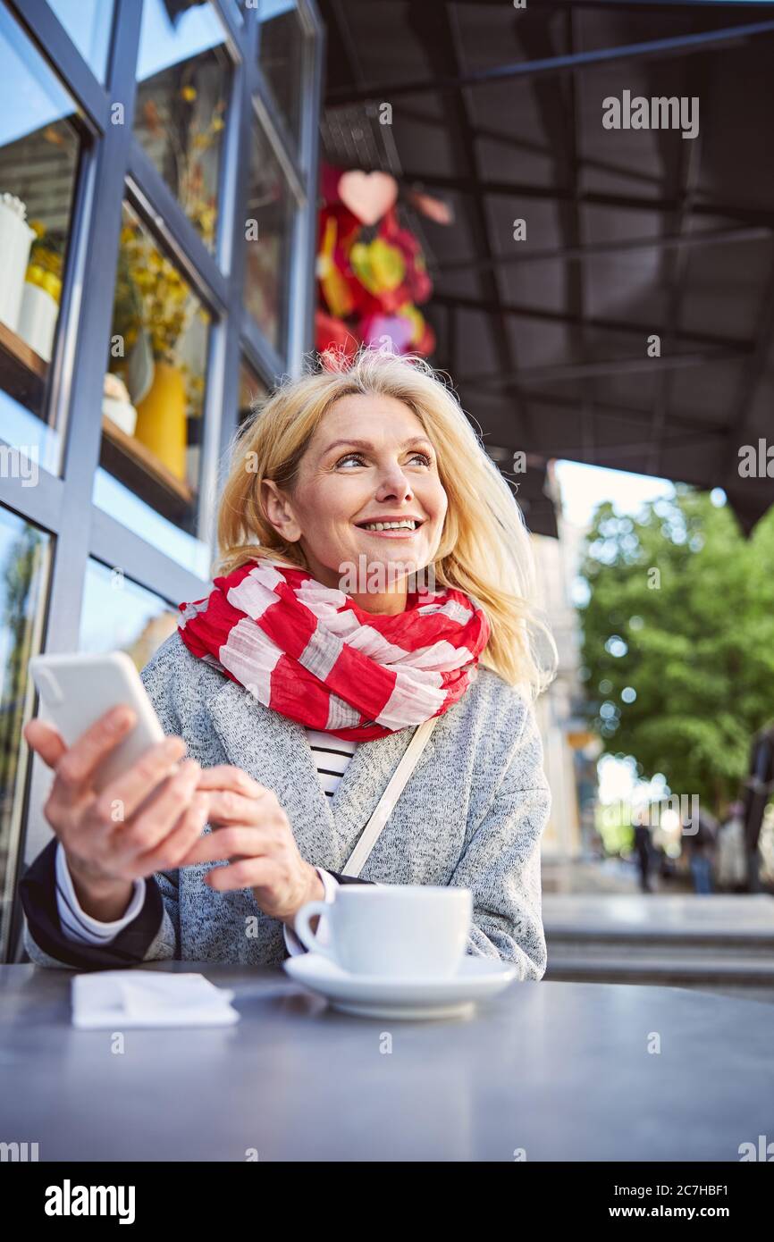 Happy cheerful lady posing at the photo camera Stock Photo - Alamy