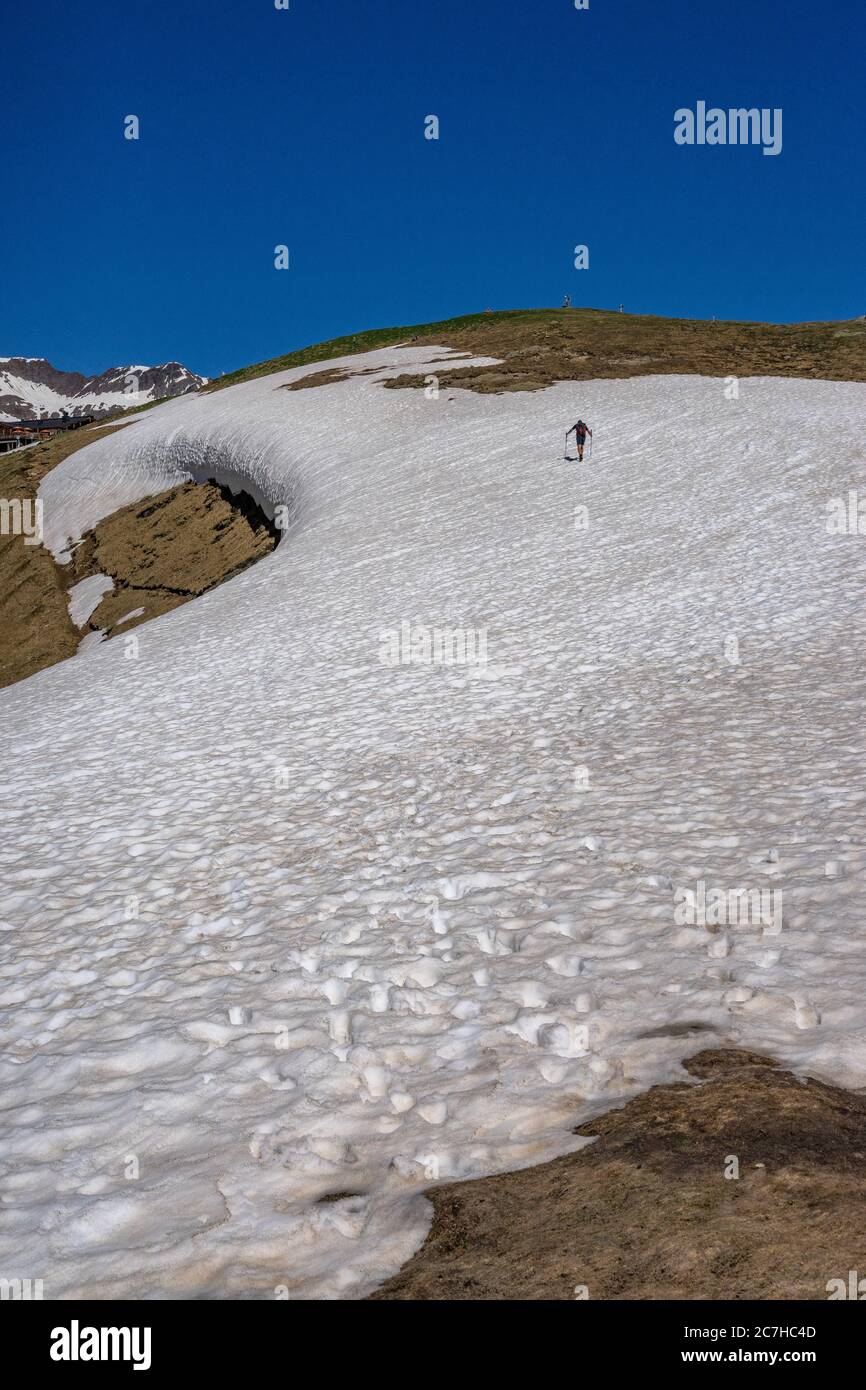 Europe, Austria, Tyrol, Ötztal Alps, Ötztal, hikers climb an old snow field up to the Hohe Mut Stock Photo