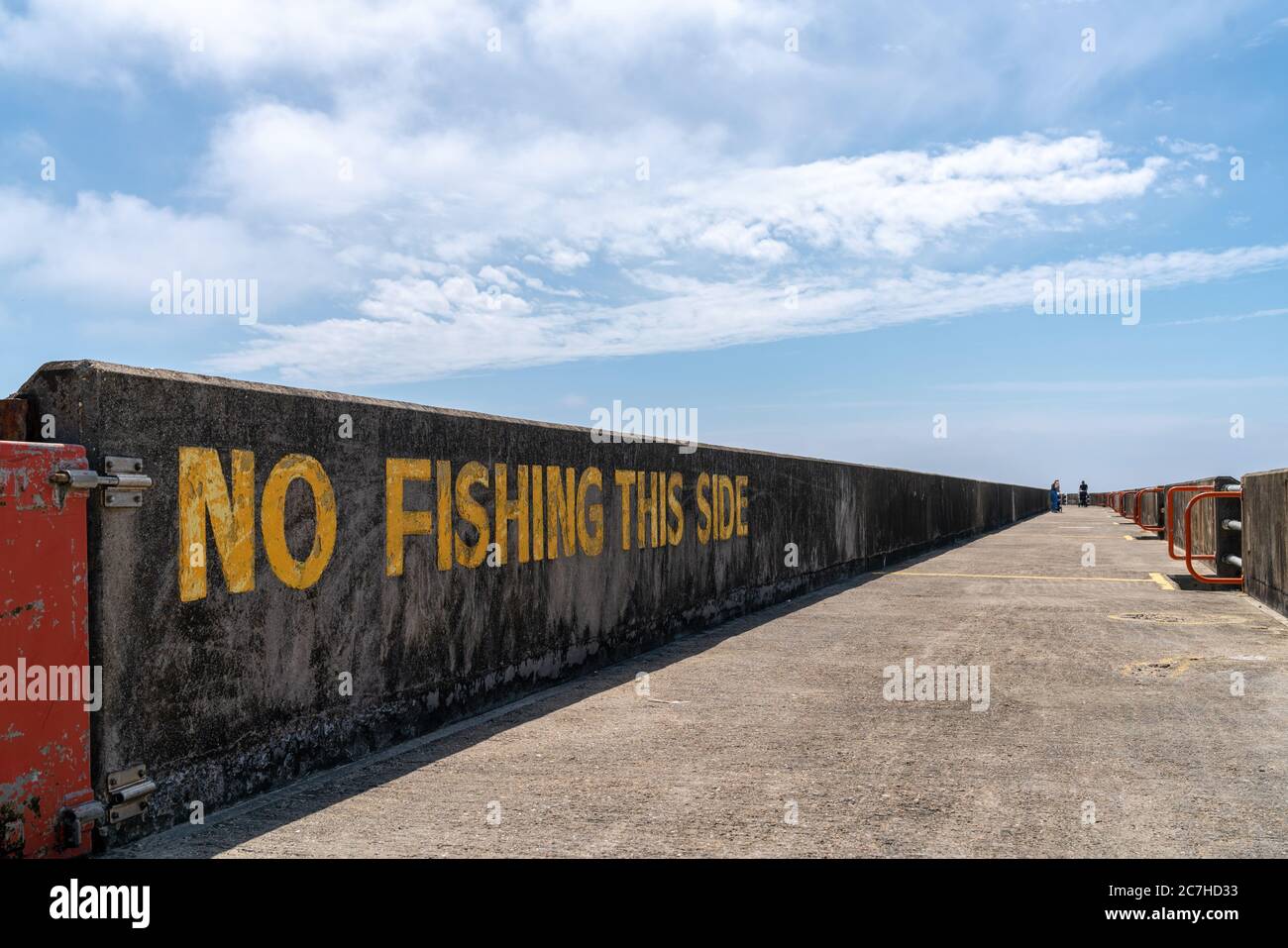 16th June 2020 - Brighton, UK. Warning sign No Fishing This Side painted on the wall at Brighton Marina. Stock Photo