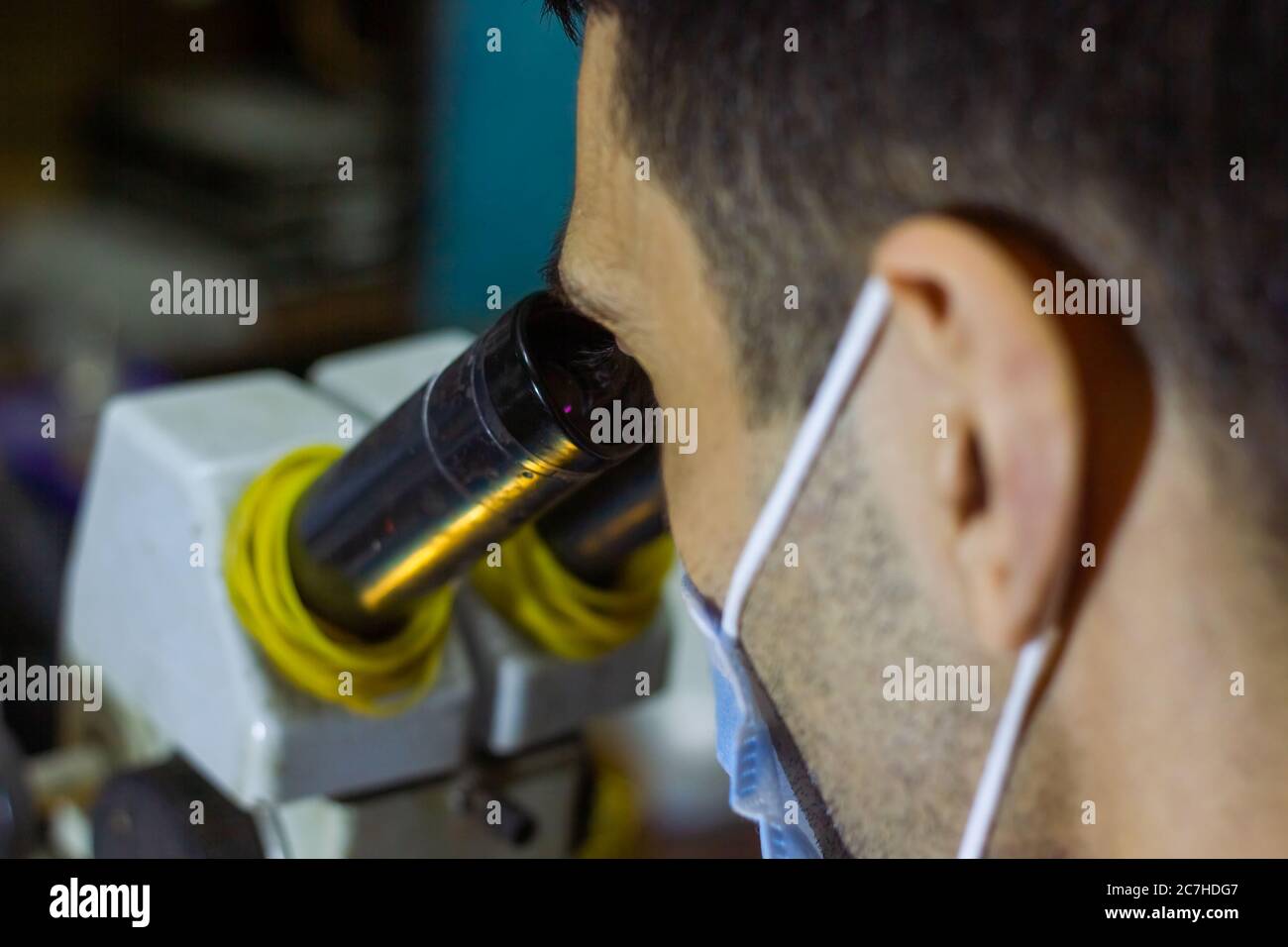service worker repairing mobile phone with microscope Stock Photo Alamy