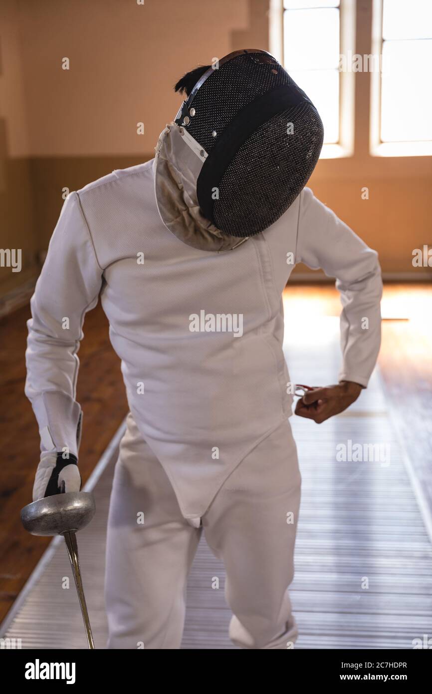 Man wearing fencing gear Stock Photo