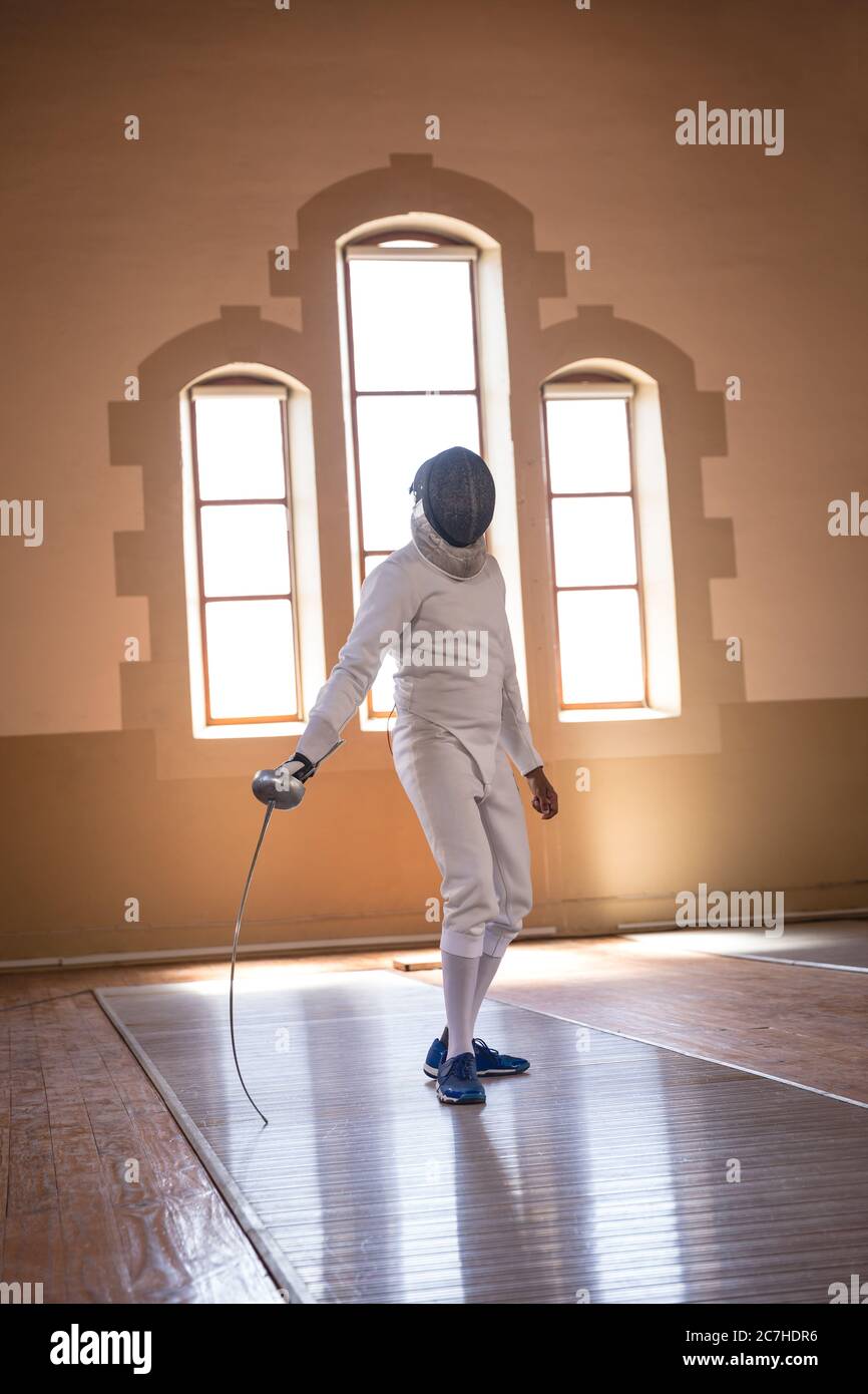 Man practicing fencing Stock Photo