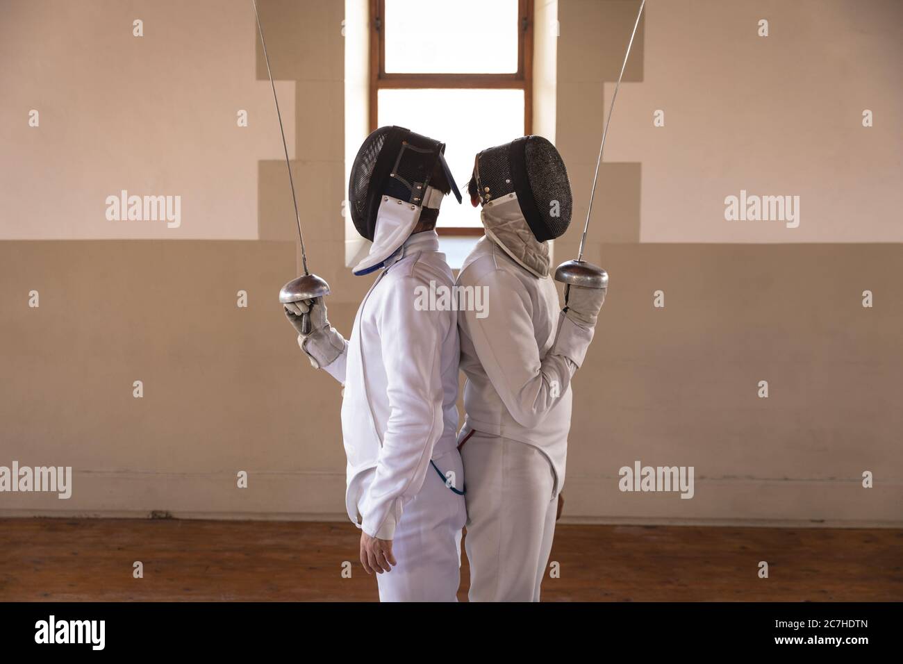 Two female fencers holding fencing foil Stock Photo