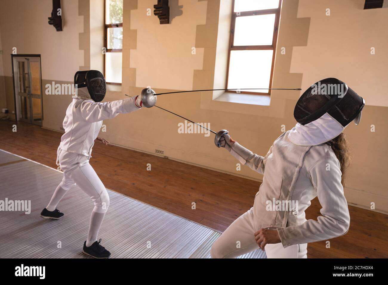 Two female fencers practicing fencing Stock Photo
