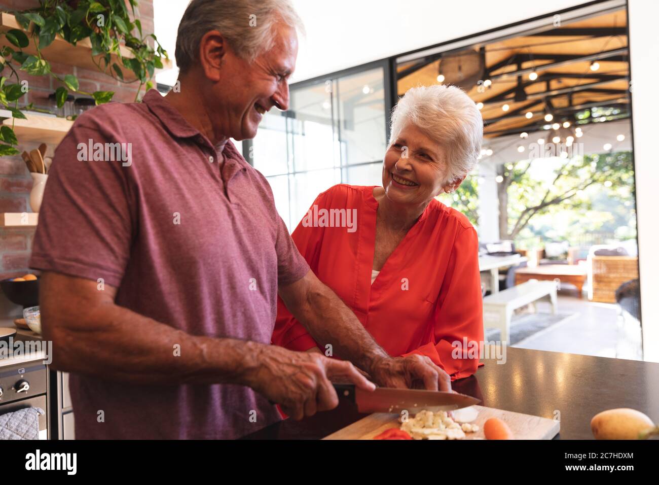 Caucasian senior couple cooking together at home Stock Photo