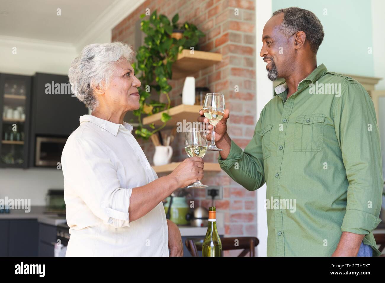 Senior African American couple toasting Stock Photo
