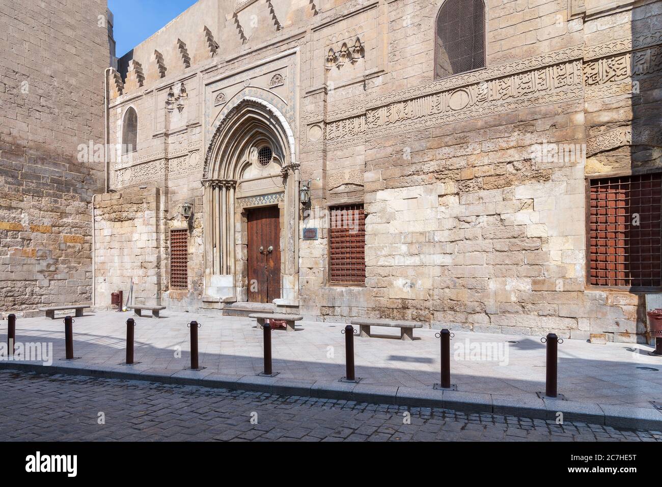 Facade of theological school and Mausoleum of Sultan Qalawun, Mamluk era historic building, at Moez Street, Gamalia district with no visitors during Covid-19 lockdown period, Old Cairo, Egypt Stock Photo