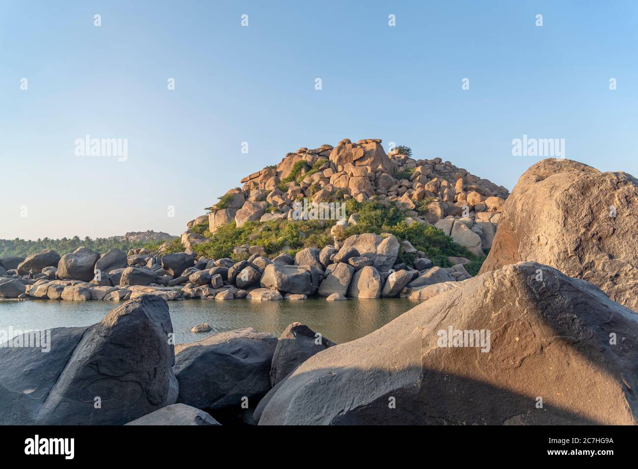 Boulders on water Stock Photo