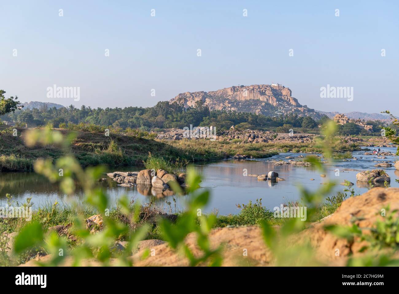 Rugged mountain in a green landscape Stock Photo