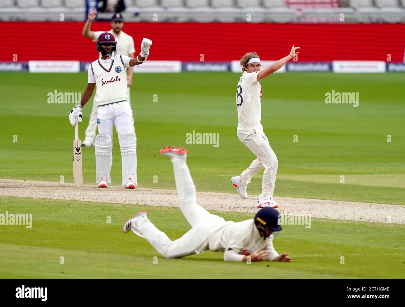 England’s Sam Curran appeals for the wicket of West Indies’ Alzarri Joseph during day two of the Second Test at Old Trafford, Manchester. Stock Photo