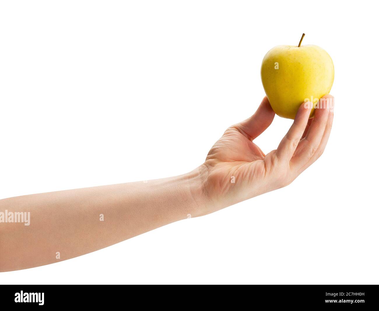 golden delicious apple in hand path isolated on white Stock Photo