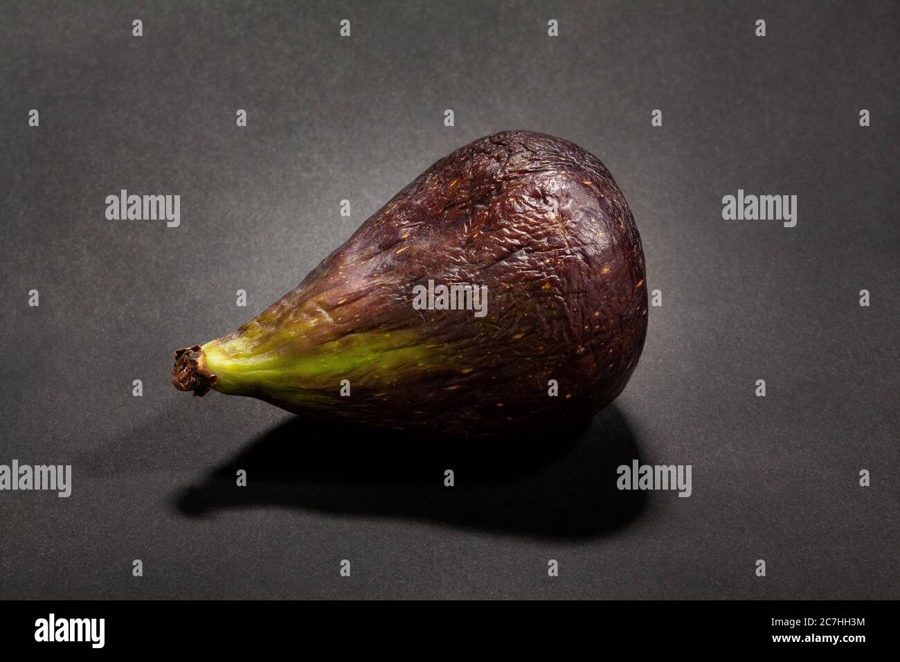 single fig on black background Stock Photo