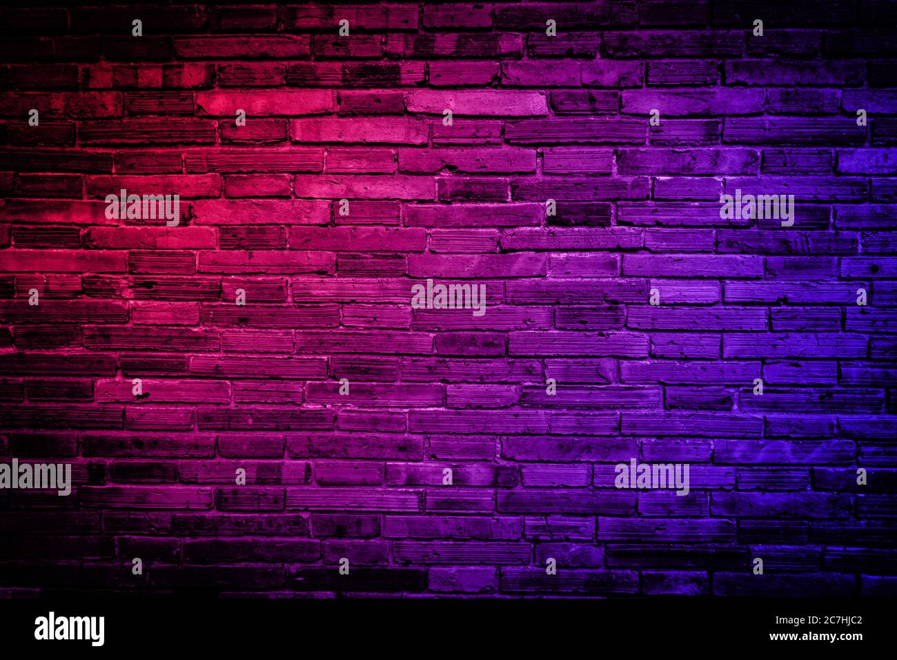 Neon light on brick walls that are not plastered background and texture.  Lighting effect red and blue neon background vertical of empty brick  basement Stock Photo - Alamy