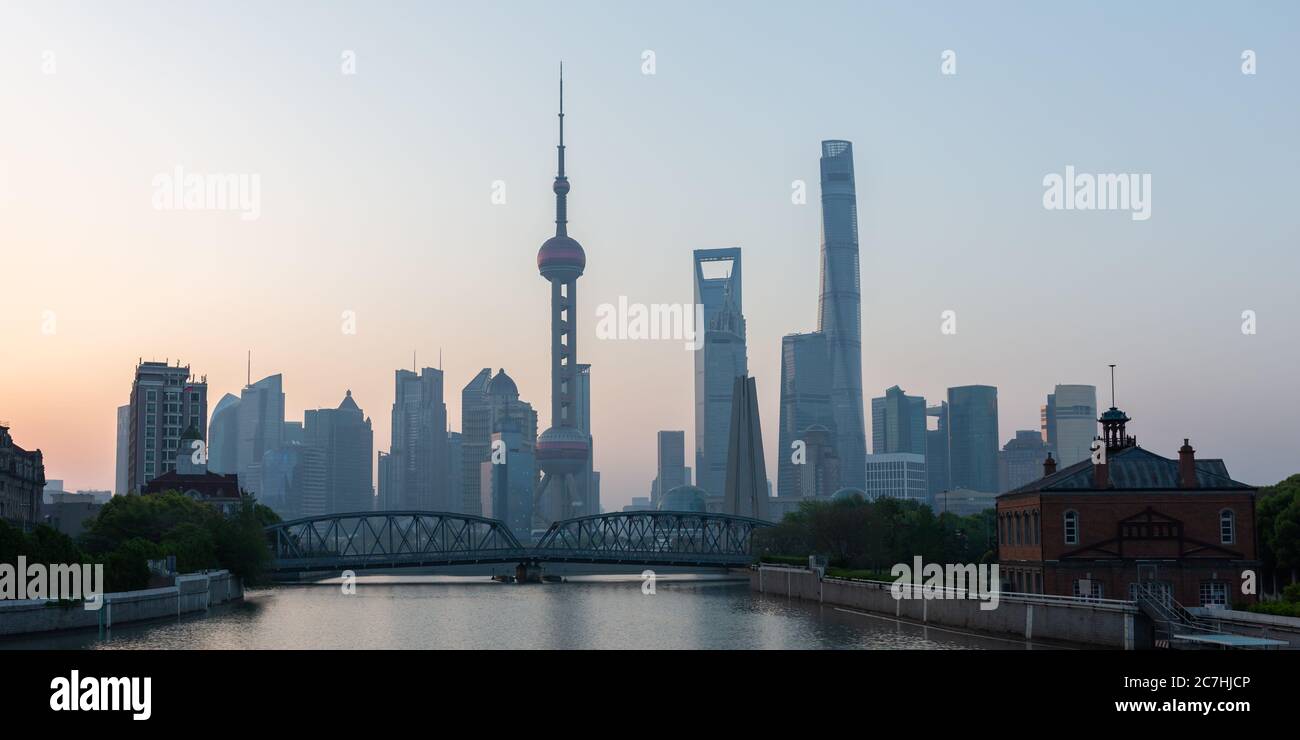 Panorama of the Shanghai Pudong skyline with Garden Bridge (Waibaidu Bridge) in the foreground. Stock Photo