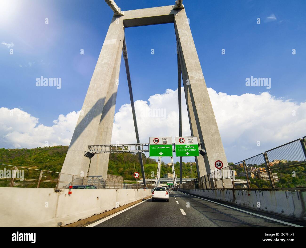 Morandi Bridge in Genova, Italy. Car traffic on a beautiful day, view from a moving car Stock Photo