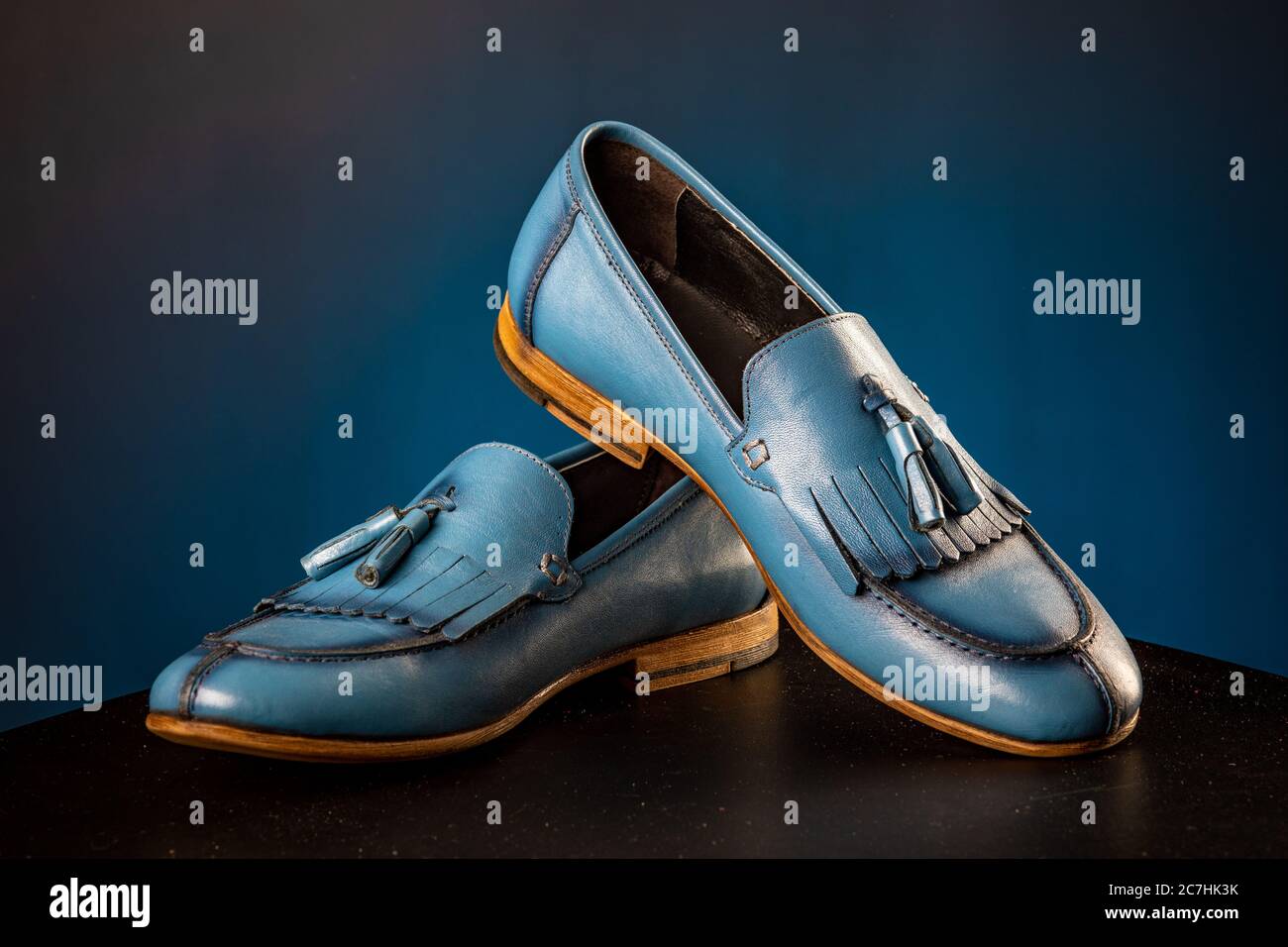 mens leather classic blue shoes on blue background Stock Photo