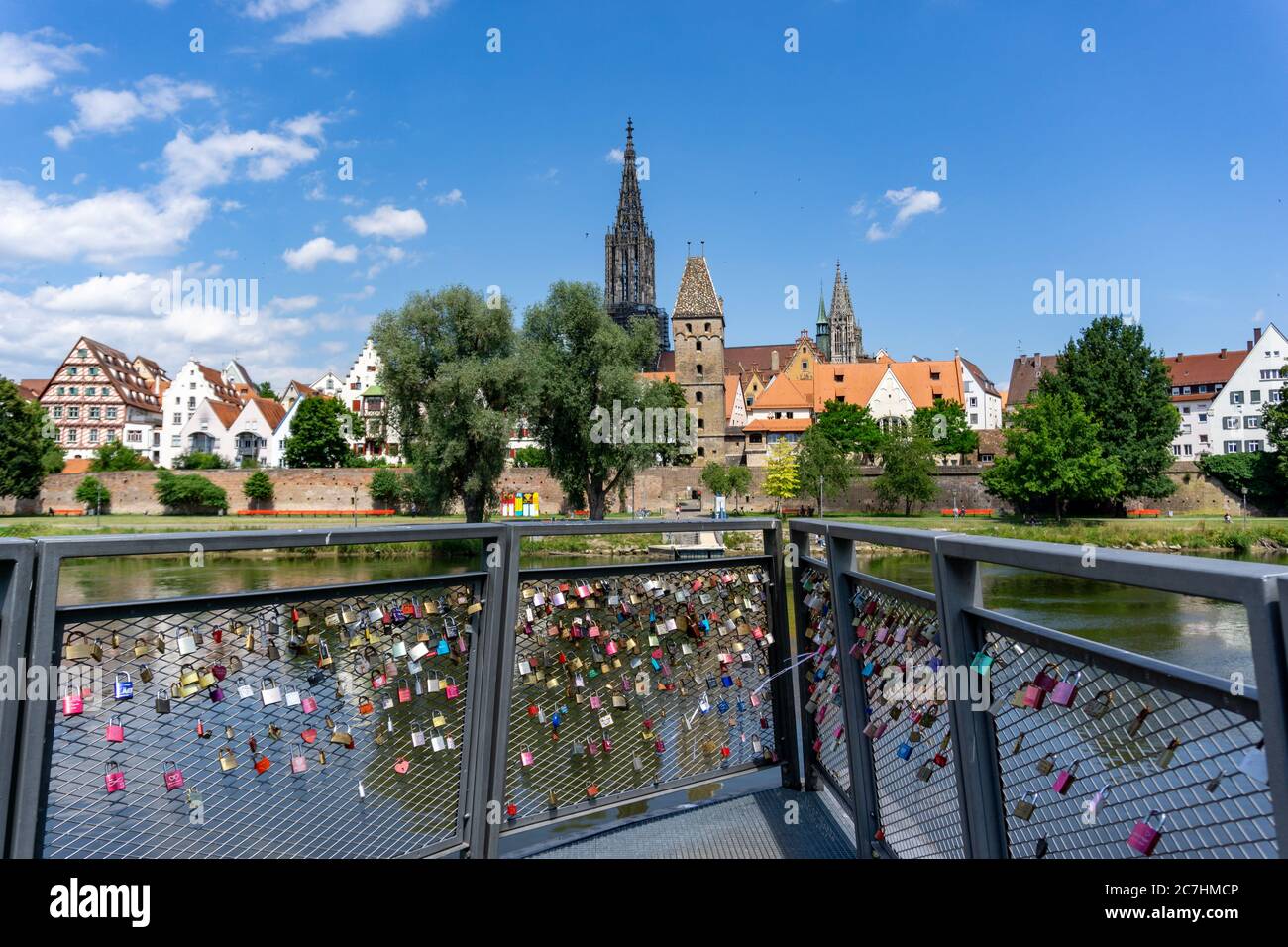 Ulm, BW / Germany - 14 July 2020: view of the city of Ulm on the Danube River with love locks in the foreground Stock Photo