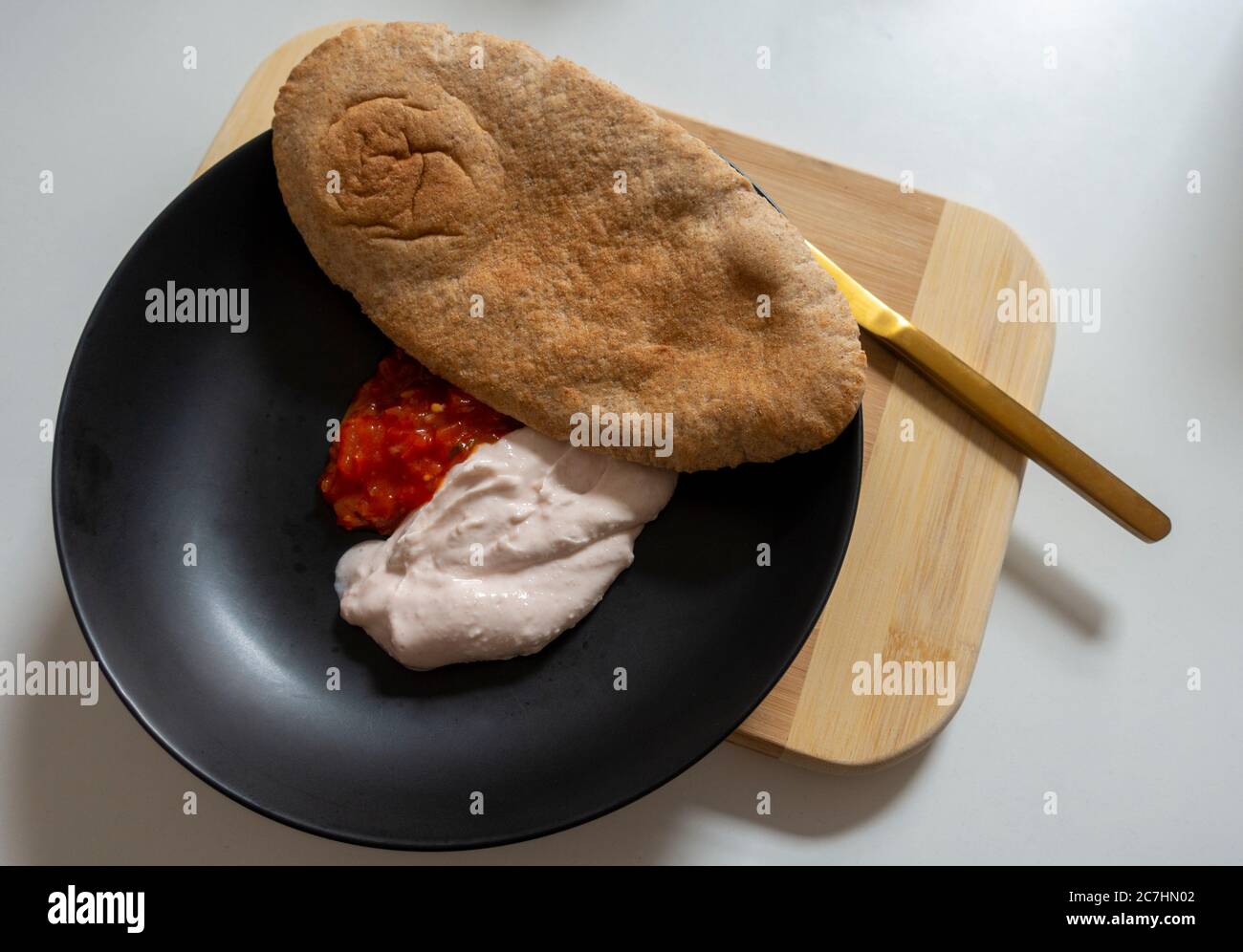Taramasalata, tomato salsa, and pitta bread Stock Photo