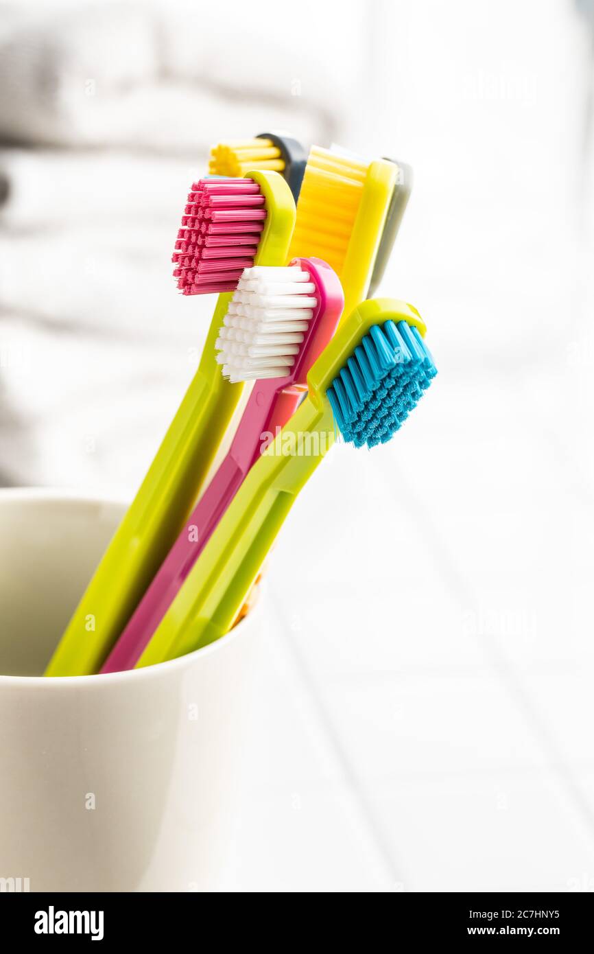 Toothbrush and toothpaste in cup hires stock photography and images