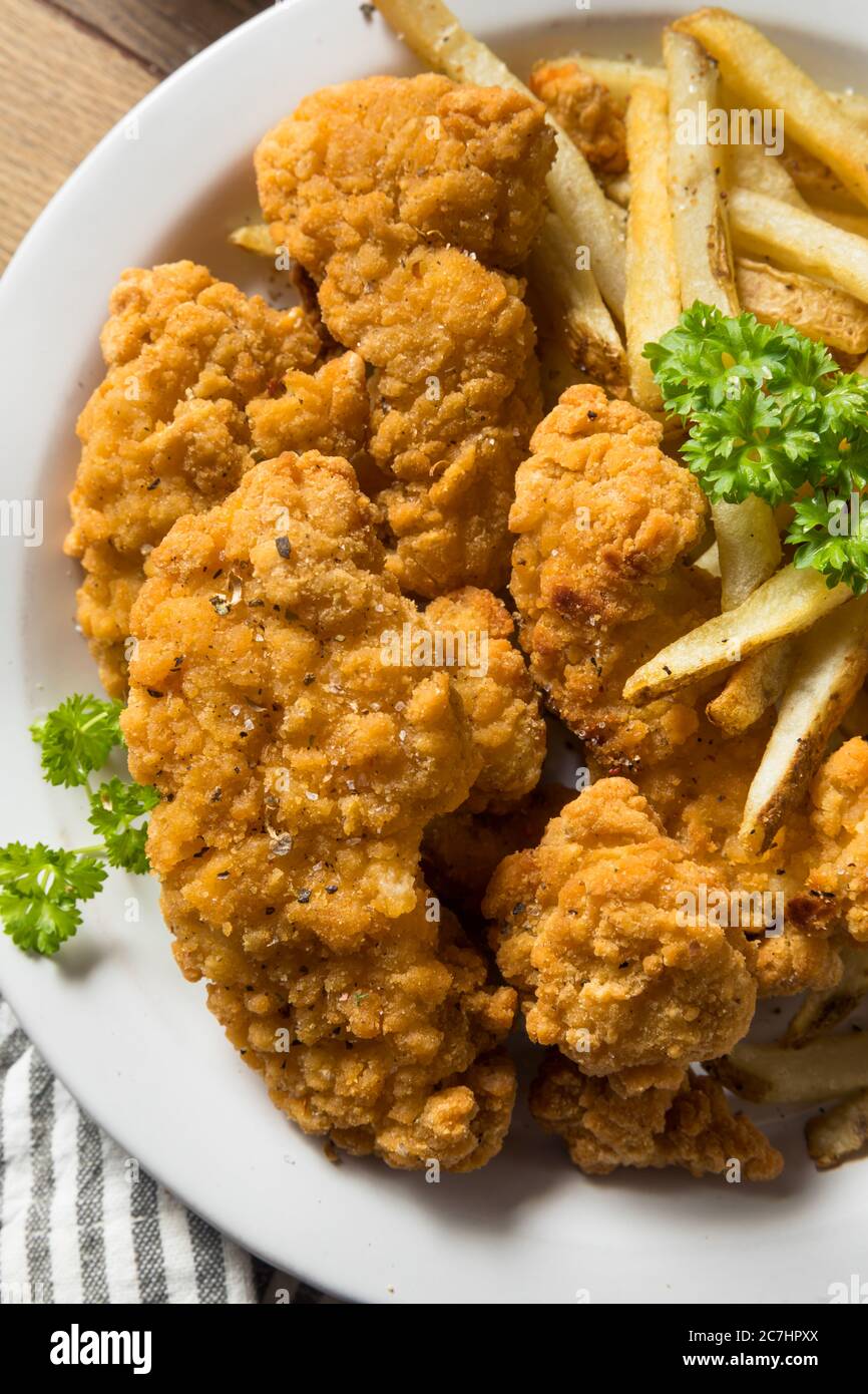 Deep Fried Chicken Tenders and Fries with Sauce Stock Photo Alamy