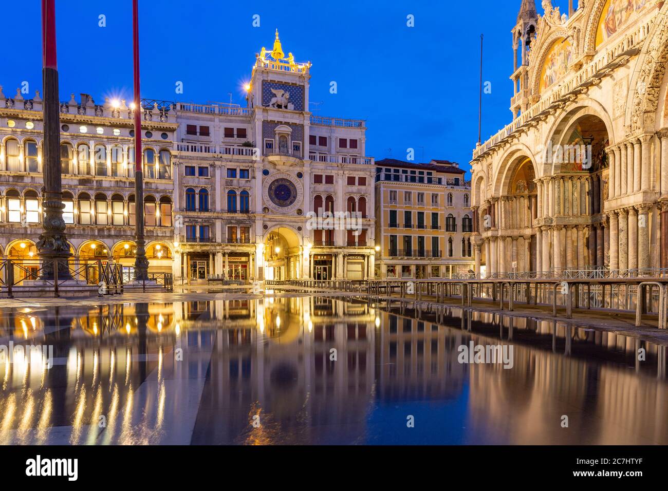 Reflection on St. Mark's Square, St. Mark's Basilica, clock tower, Venice, Italy Stock Photo
