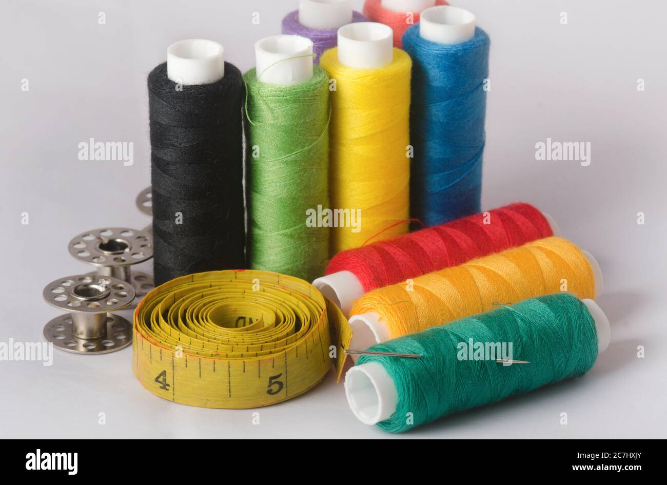 Sewing tools collection. thread sewing needle, measuring tape, bobbins ...